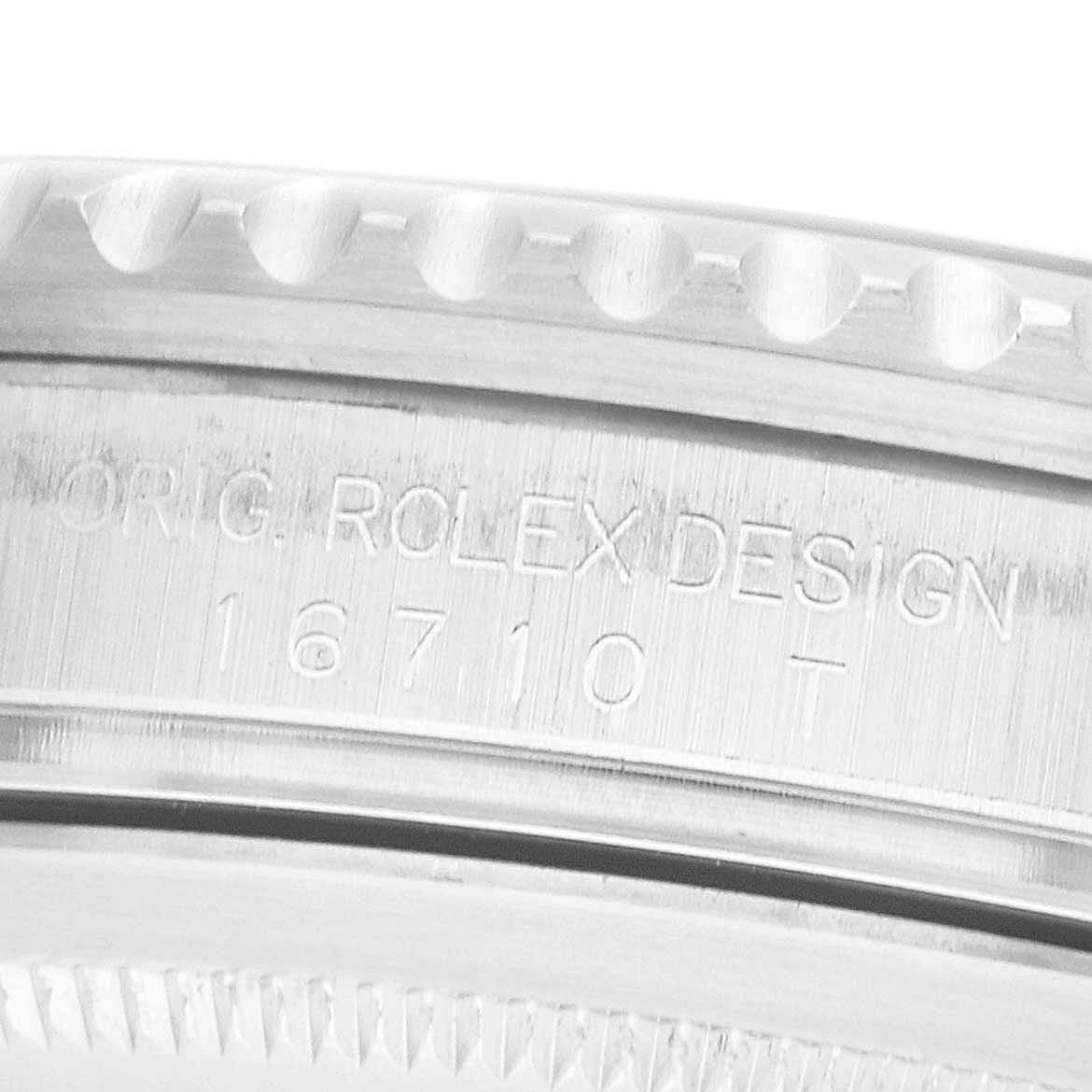 The image shows a close-up of the case side, displaying engraved text of the Rolex GMT-Master 16710 Men's Stainless Steel Black Dial model.
