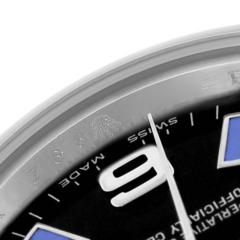 The image shows a close-up of the dial and bezel edge of a Rolex Oyster Perpetual 176200 Women's Stainless Steel Black Dial 176200 Women's Stainless Steel Black Dial watch, highlighting the numeral "9" and text details.