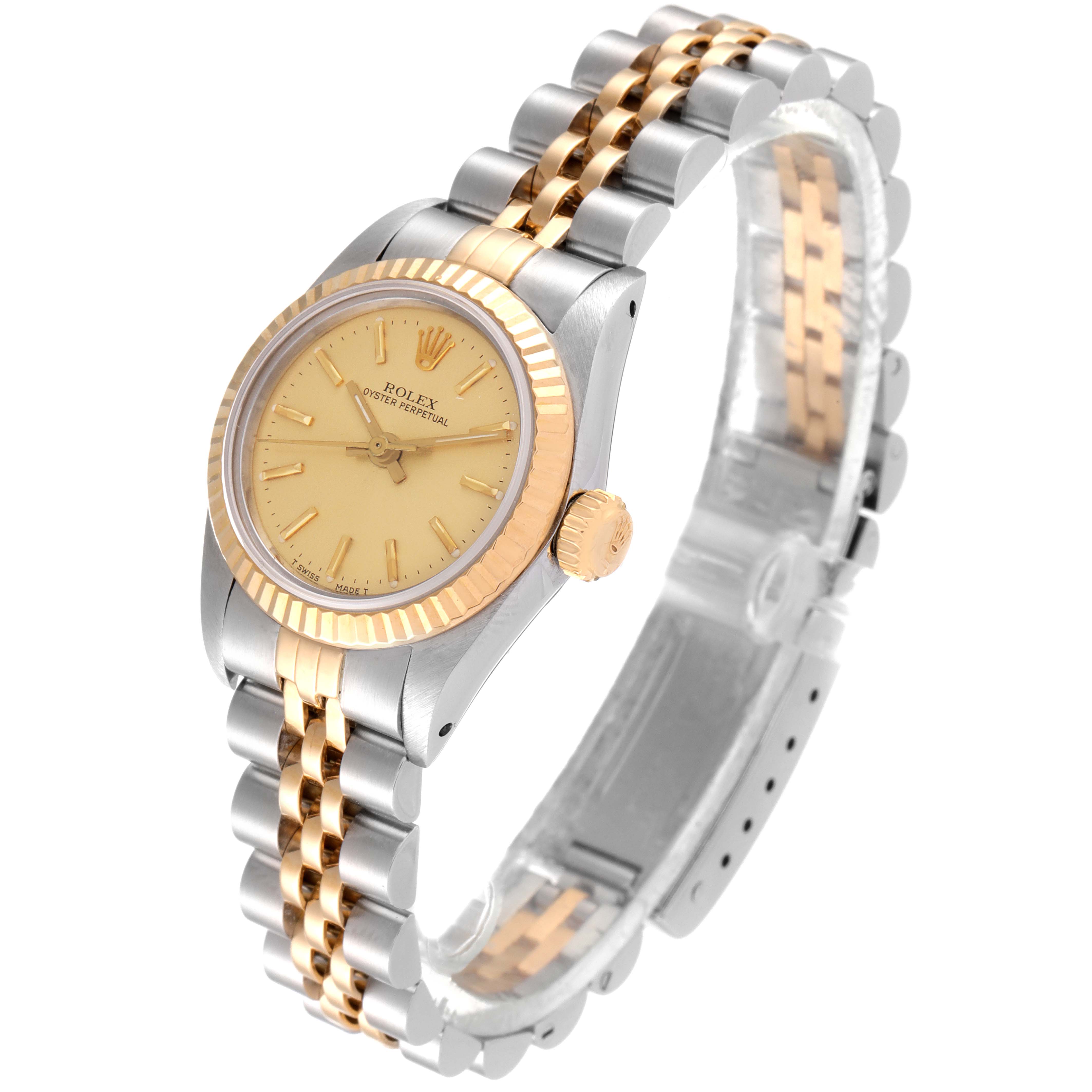 The Rolex Oyster Perpetual 67193 Women
s Steel and Gold (two tone) Champagne Dial 67193 Women
s Steel and Gold (two tone) Champagne Dial watch is shown from a three-quarter angle, displaying the face, bezel, crown, and two-tone bracelet.