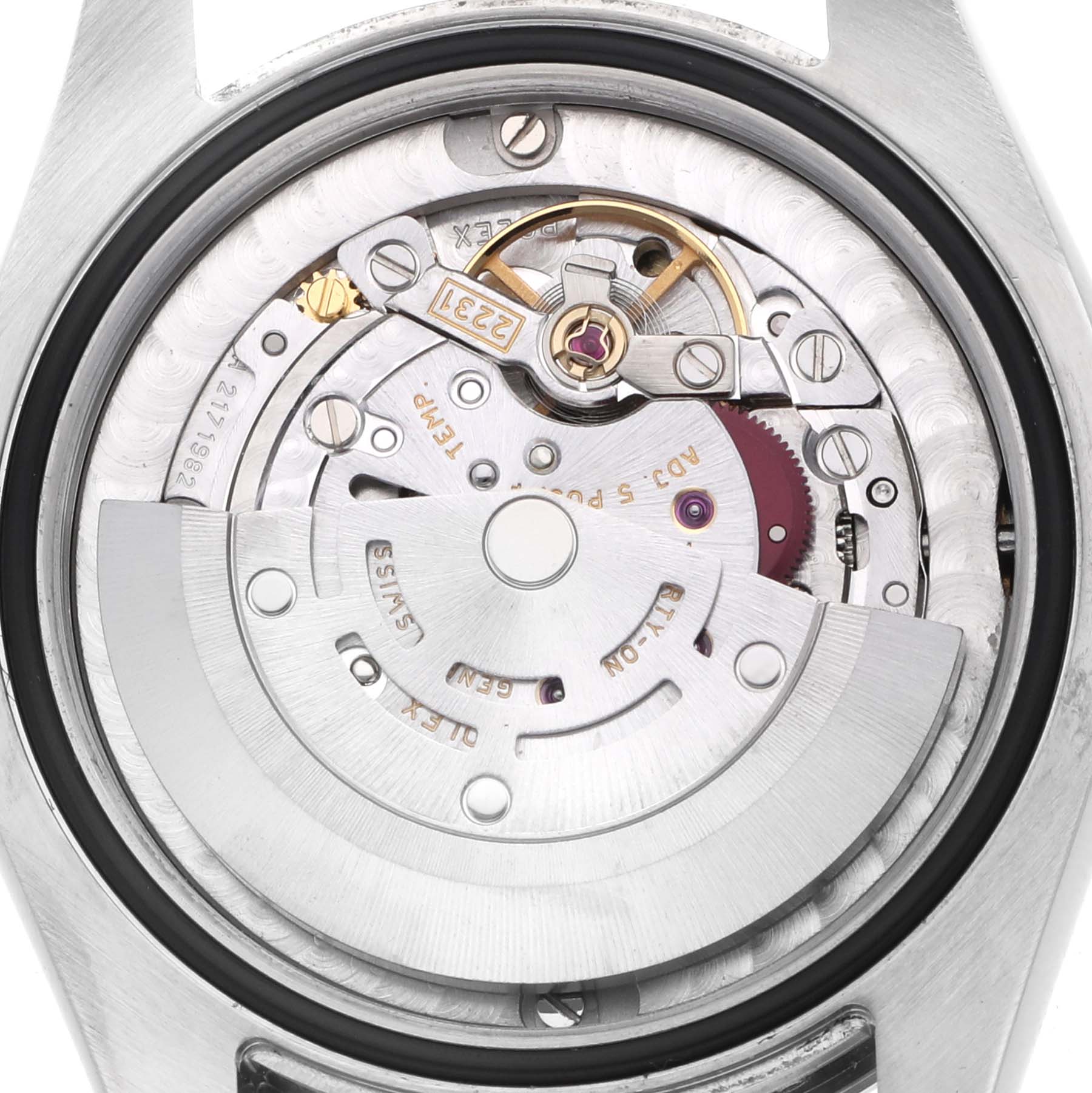 The image shows the Oyster Perpetual Rolex watch's movement mechanism from the back, highlighting gears and the oscillating weight.