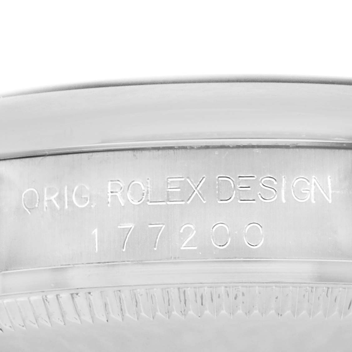 The image shows the side engraved with “ORIG. ROLEX DESIGN 177200” of the Rolex Oyster Perpetual 177200 Women's Stainless Steel Black Dial watch case.