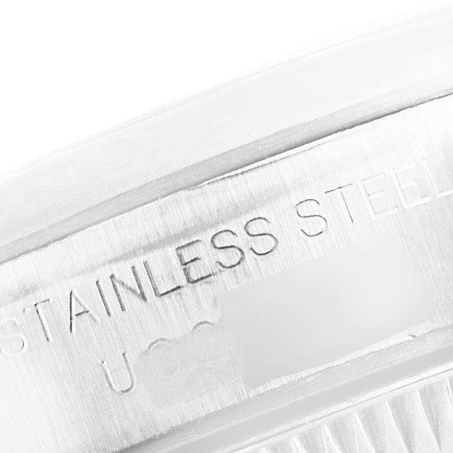 This image shows a close-up of the side of the case of an Oyster Perpetual Rolex watch, highlighting the stainless steel engraving.