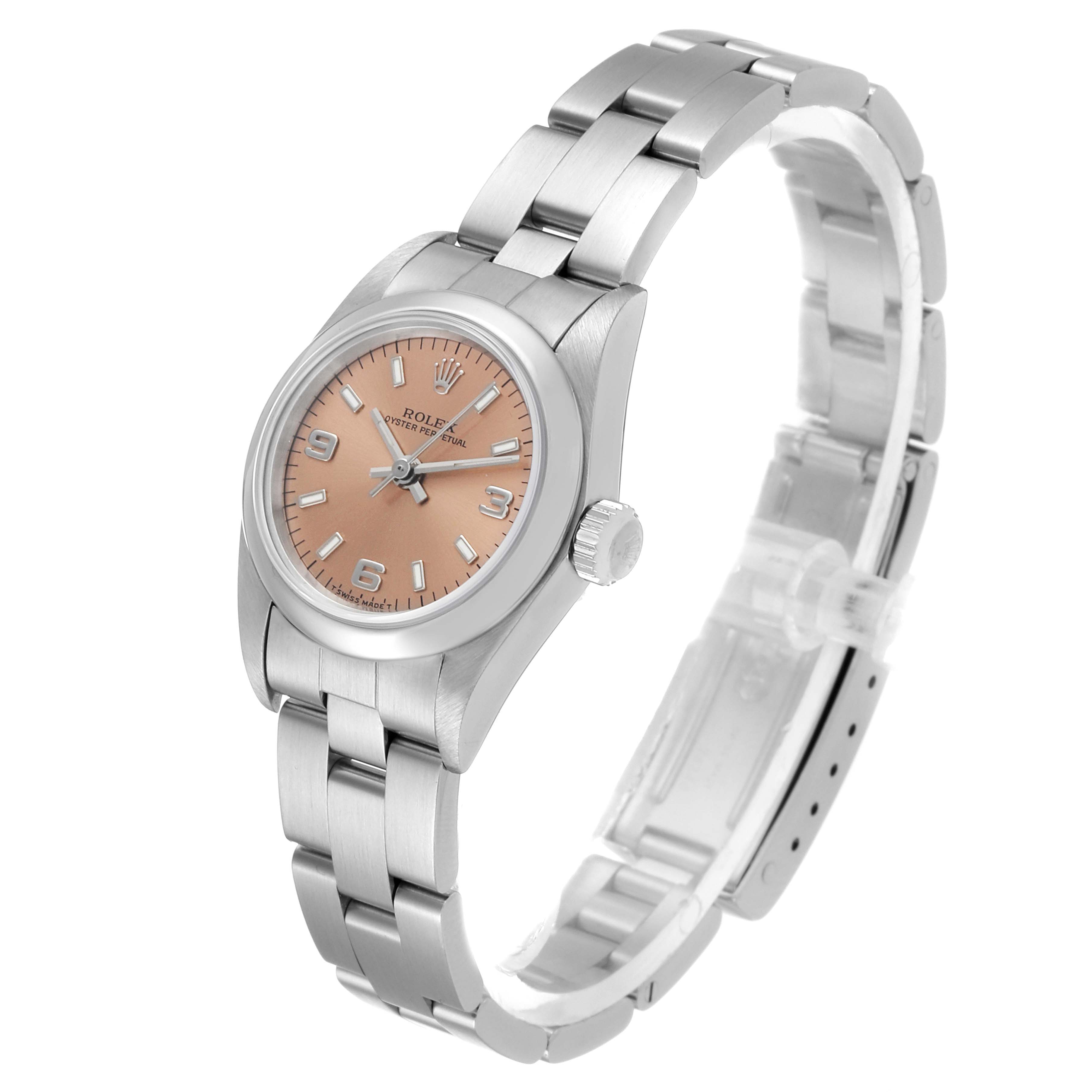 The image shows a side and front view of a Rolex Oyster Perpetual 67180 Women's Stainless Steel Pink Dial 67180 Women's Stainless Steel Pink Dial watch with a pink dial and stainless steel bracelet.