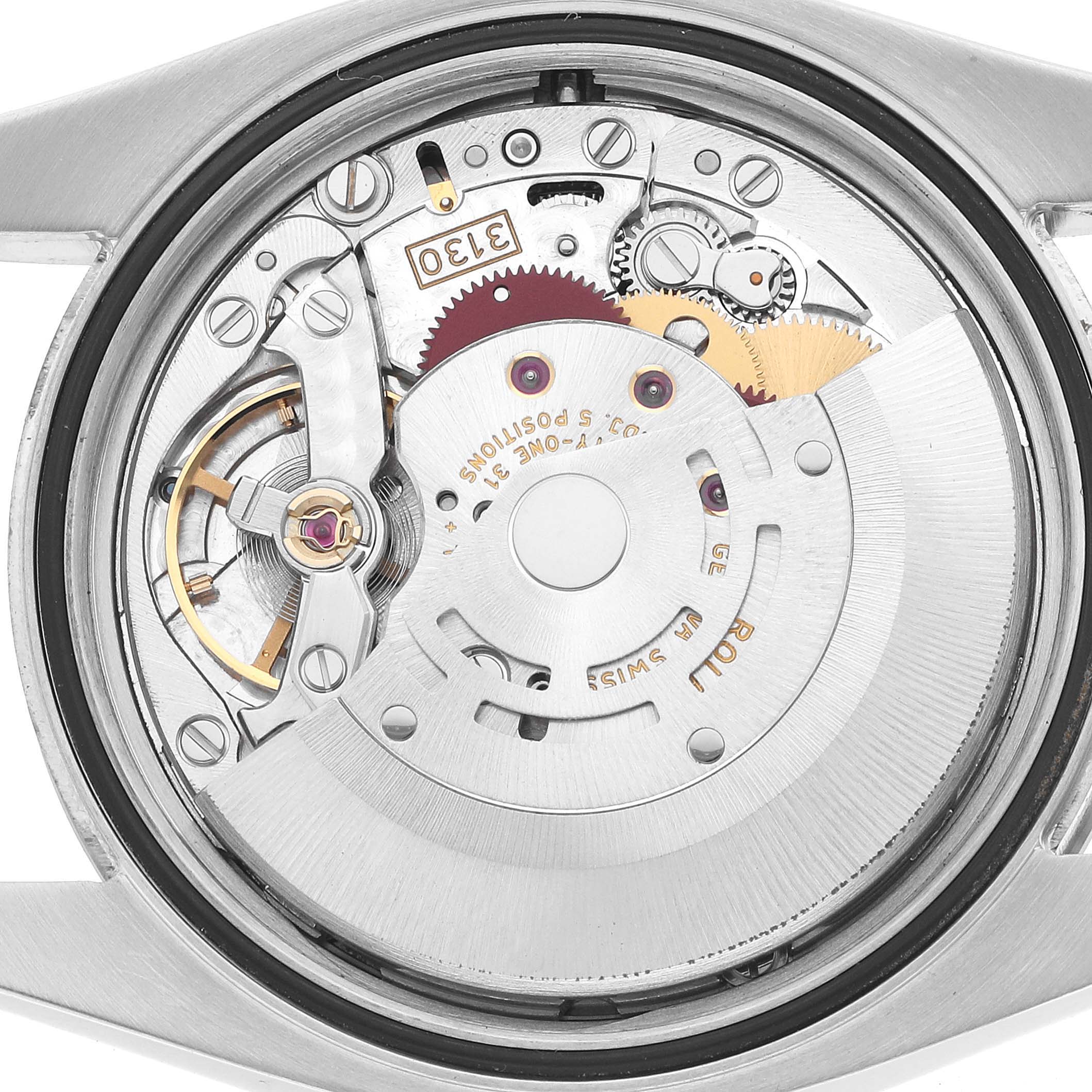 The image shows the back view of a Rolex Oyster Perpetual 116034 Men's Stainless Steel Pink Dial, focusing on its intricate movement components.