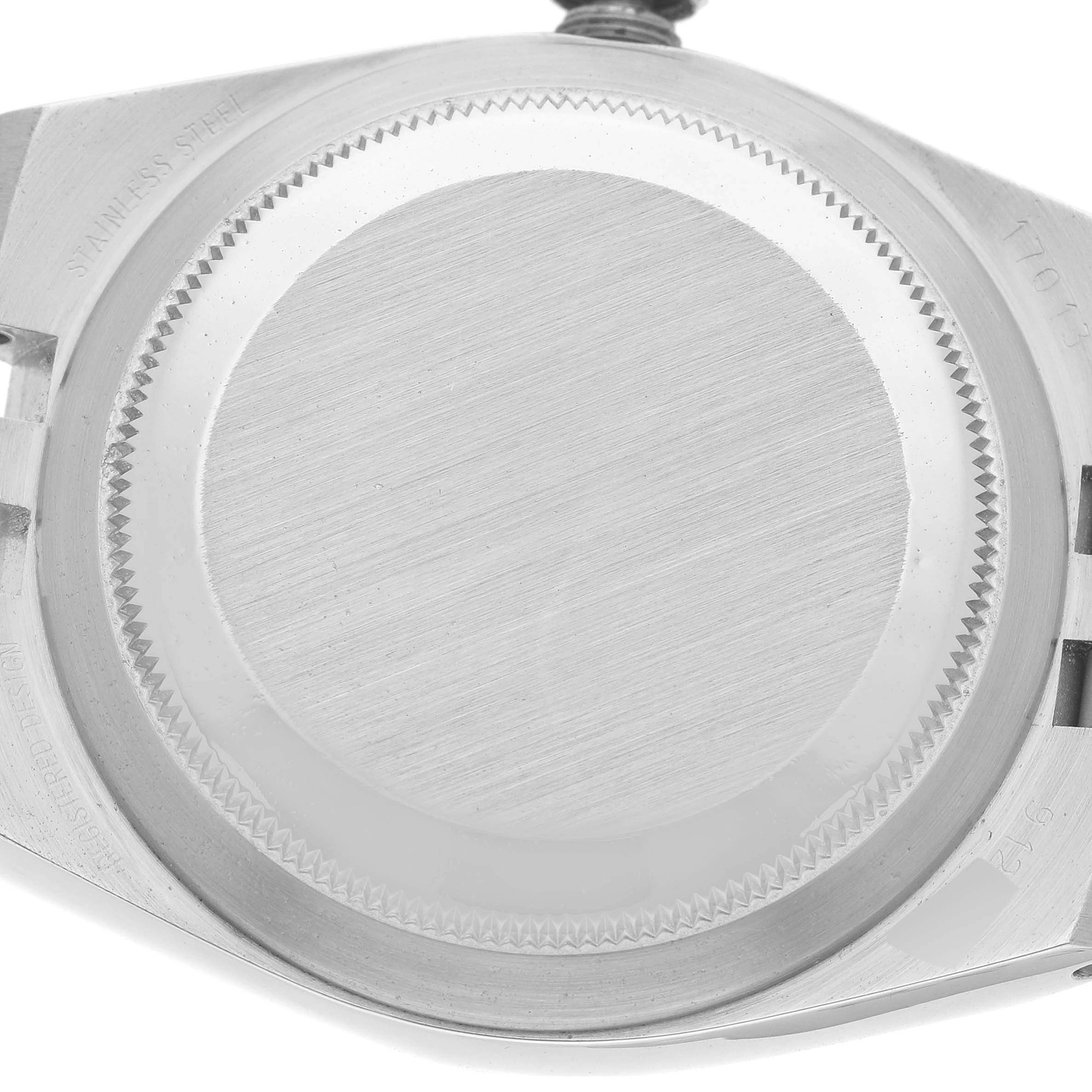 This image shows the case back of a Rolex Oysterquartz 17013 Men
s Steel and Gold (two tone) White Dial 17013 Men
s Steel and Gold (two tone) White Dial watch, viewed from the back side.