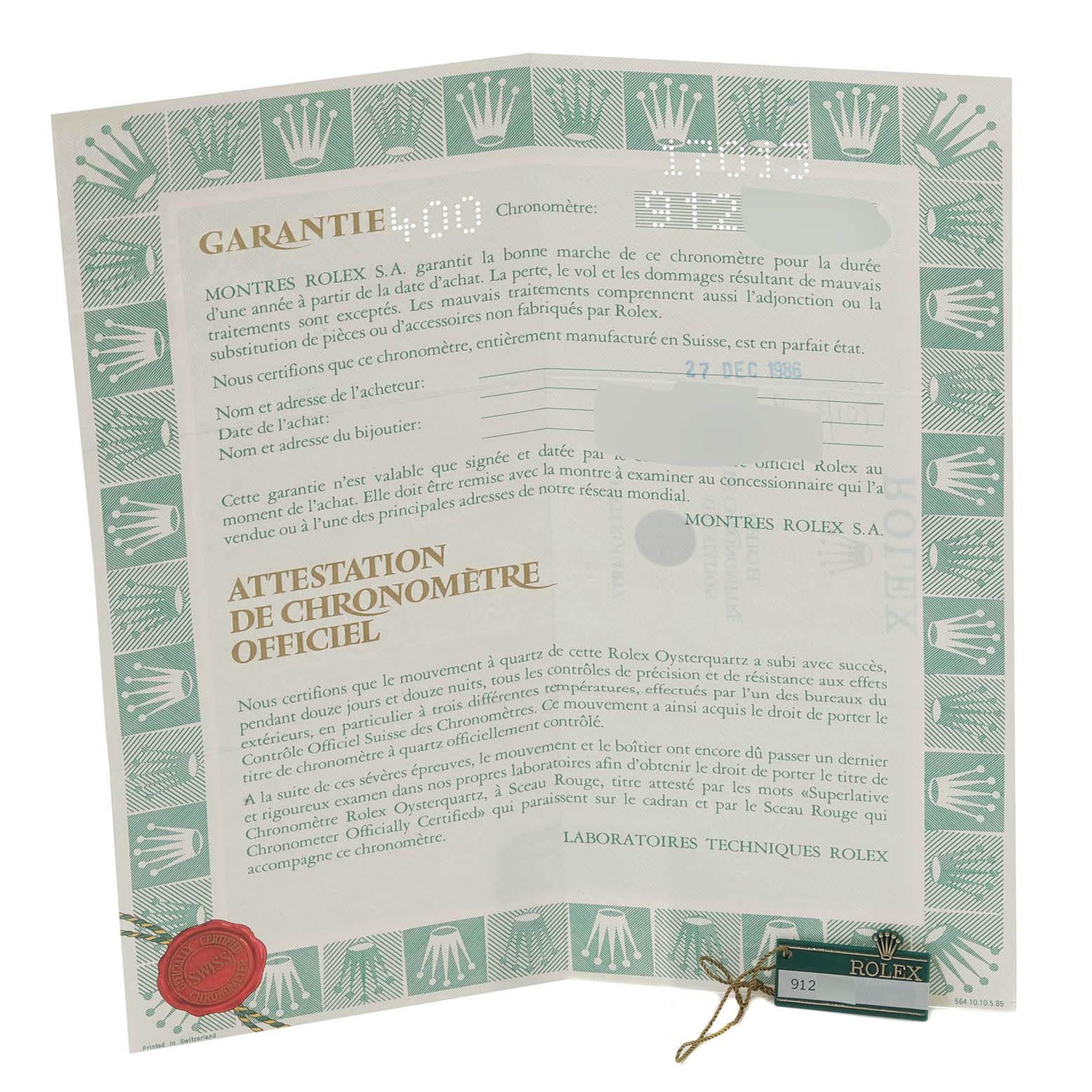 The image shows an official chronometer certificate and warranty for a Rolex Oysterquartz 17013 Men
s Steel and Gold (two tone) White Dial 17013 Men
s Steel and Gold (two tone) White Dial watch from a top-down angle.