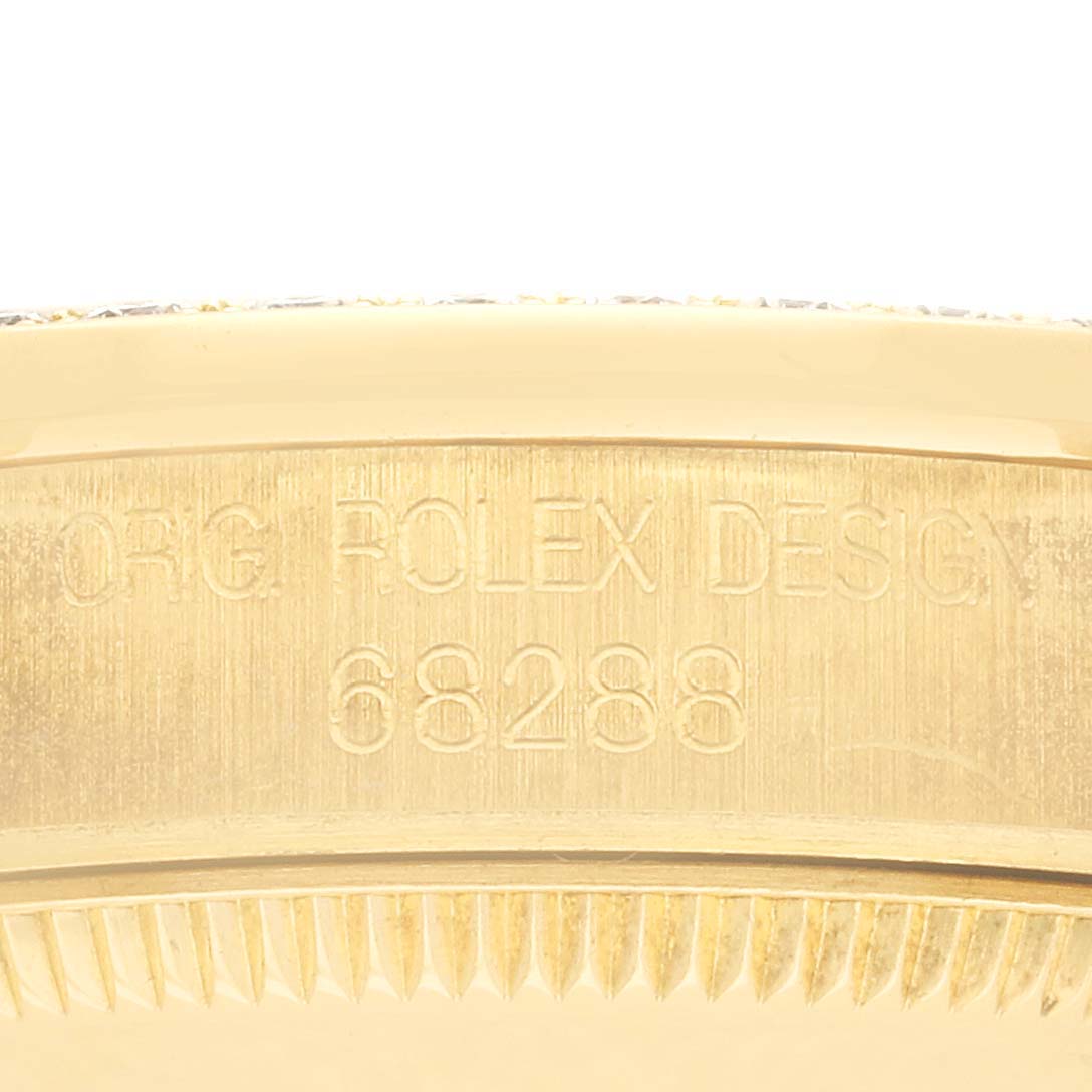The image shows the side of a Rolex President 68288 Women's Yellow Gold Champagne Dial 68288 Women's Yellow Gold Champagne Dial model, highlighting the engraved serial and model numbers on the watch case.