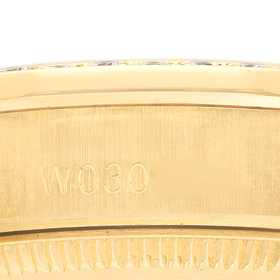 The image shows an engraving on the side of the gold bezel of a Rolex President 68288 Women's Yellow Gold Champagne Dial 68288 Women's Yellow Gold Champagne Dial model watch.