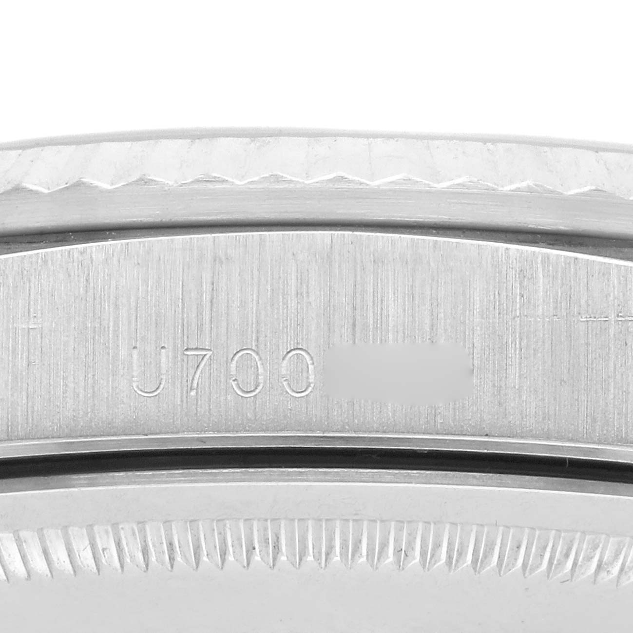 The image shows a close-up of the case side and bezel of a Rolex President 18239 Men's White Gold Silver Dial 18239 Men's White Gold Silver Dial watch, displaying the serial number engraving.