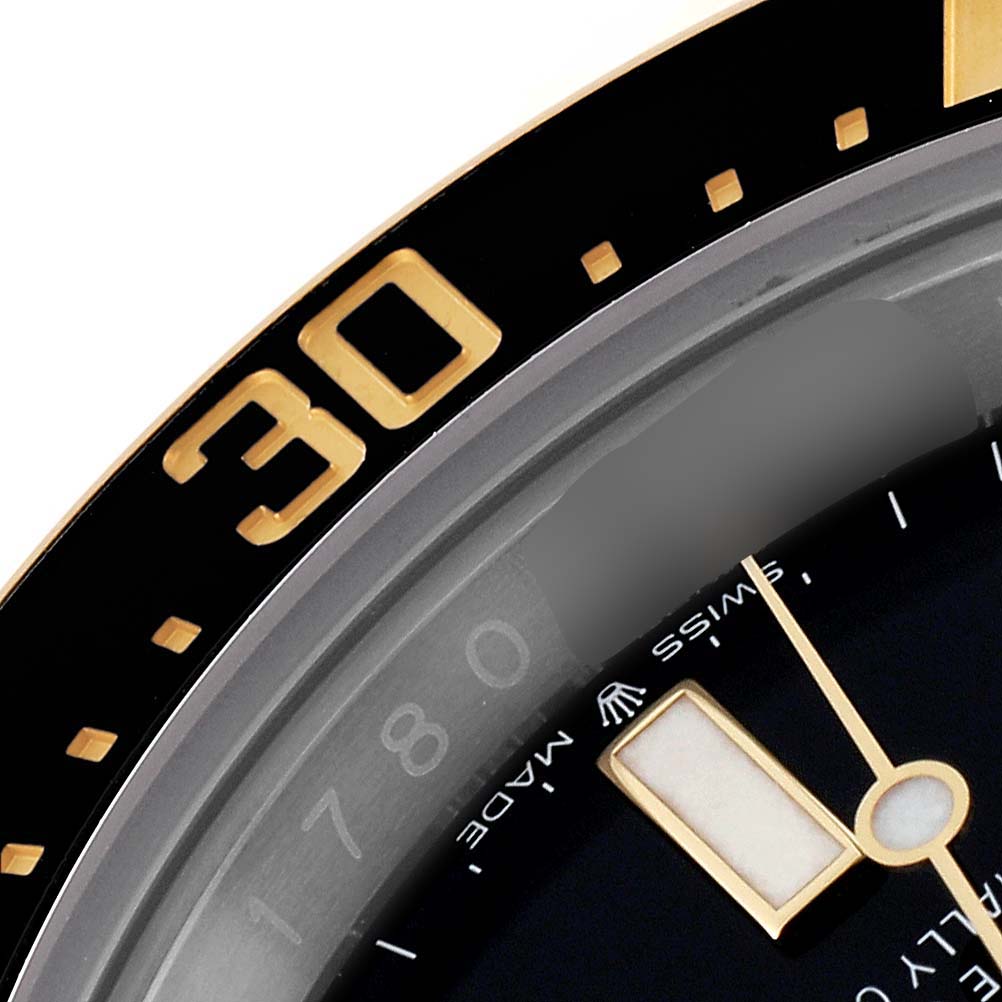 The image shows a close-up of the bezel and part of the dial, including the minute hand, of a Rolex Sea-Dweller 126603 Men's Steel and Gold (two tone) Black Dial 126603 Men's Steel and Gold (two tone) Black Dial watch.