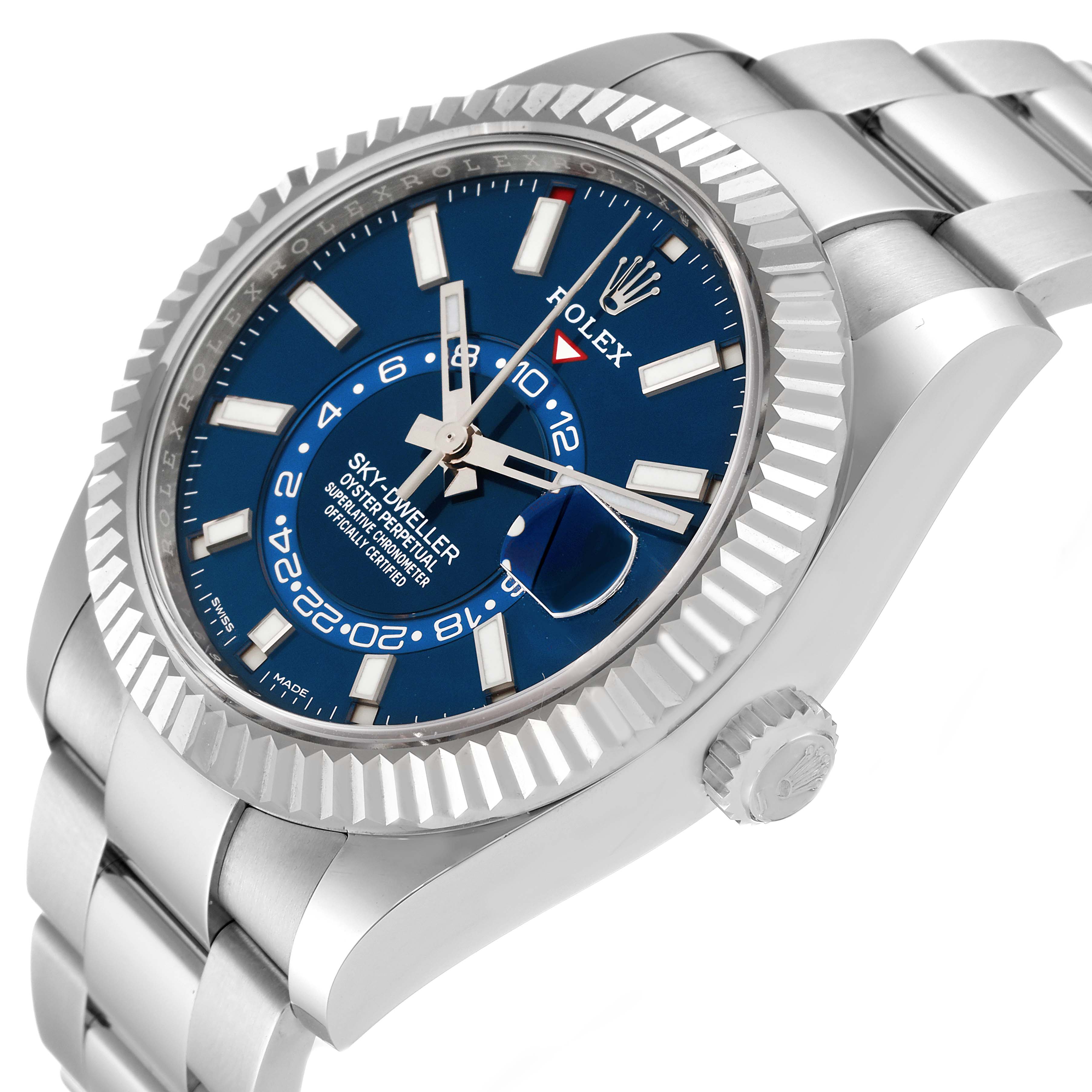 The image shows a close-up, angled view of the Rolex Sky-Dweller 326934 Men
s Stainless Steel Blue Dial 326934 Men
s Stainless Steel Blue Dial watch, highlighting its blue dial, fluted bezel, and crown.
