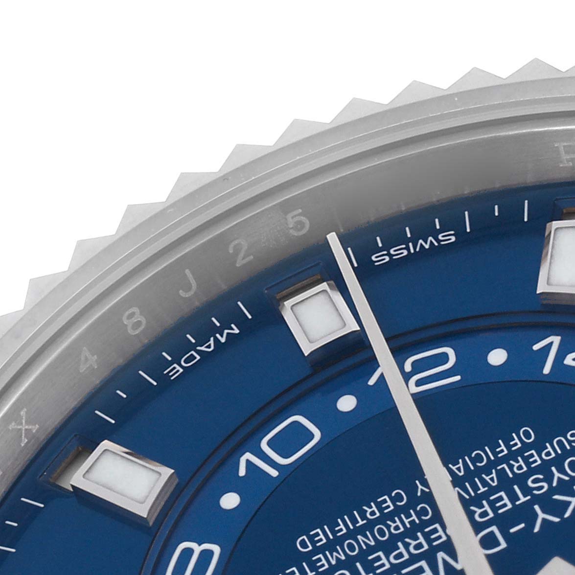 The image shows the top part of the Rolex Sky-Dweller 326934 Men's Stainless Steel Blue Dial 326934 Men's Stainless Steel Blue Dial watch with a focus on the blue dial and edge of the bezel.