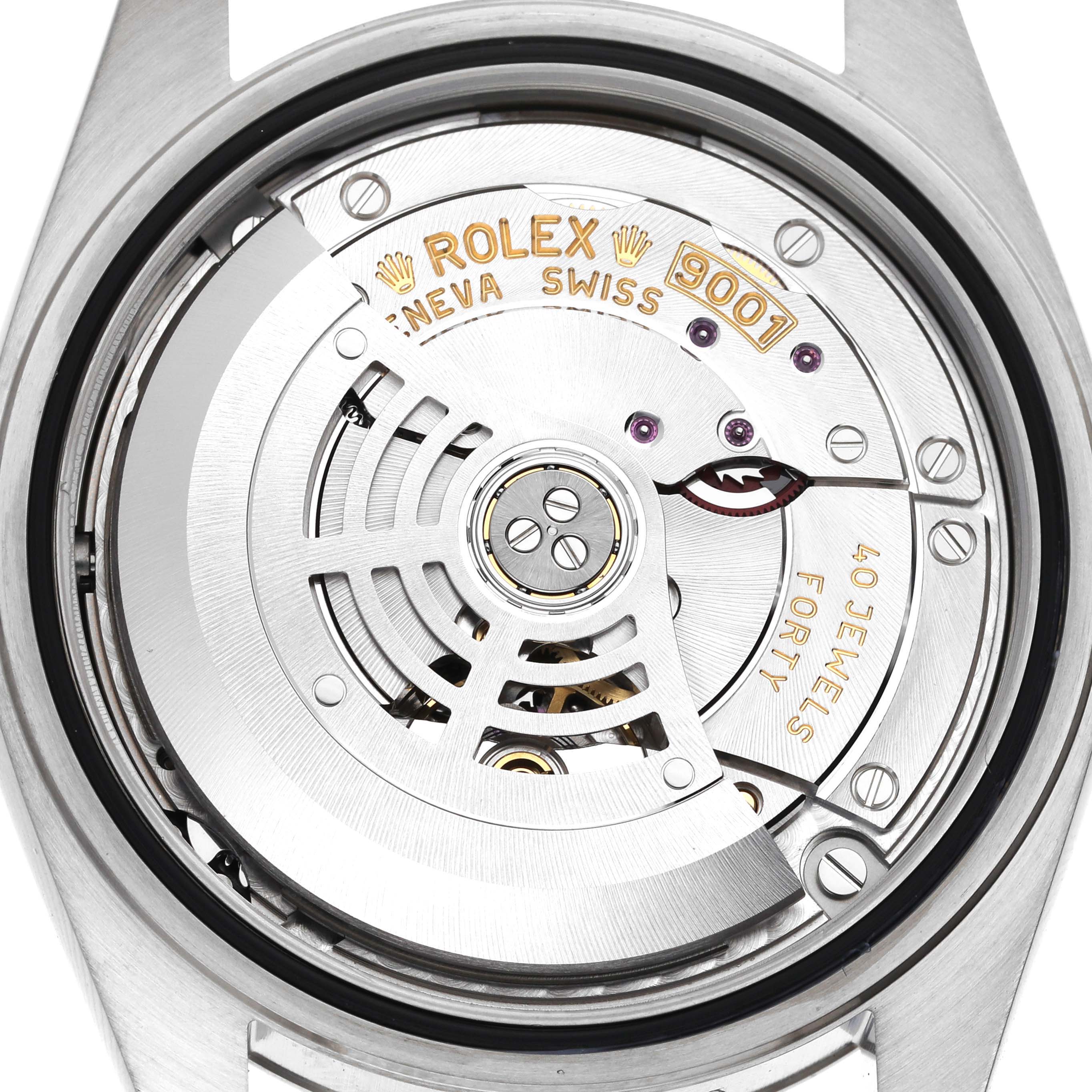 The image shows a close-up of the Rolex Sky-Dweller 326934 Men's Stainless Steel Blue Dial 326934 Men's Stainless Steel Blue Dial movement, highlighting the rotor and intricate components.