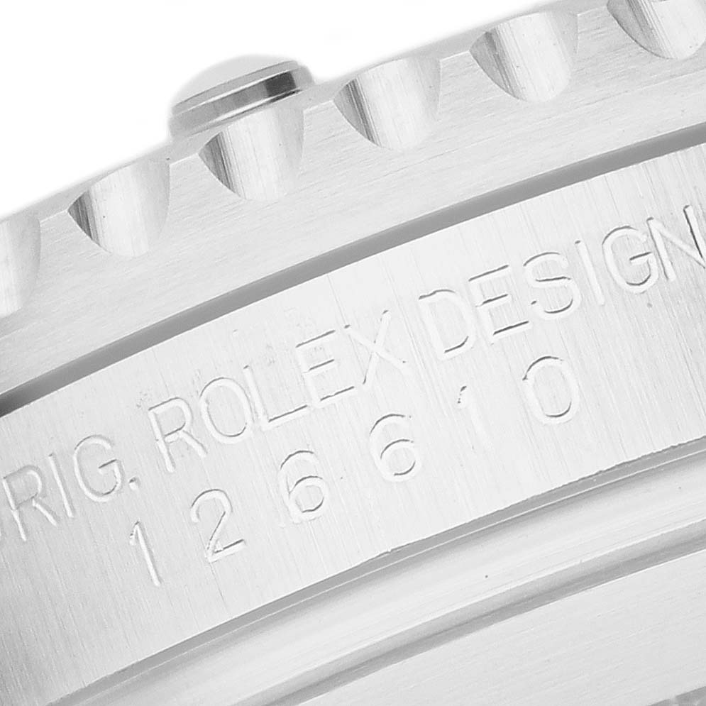 The image shows a close-up of the engraved case side of a Rolex Submariner 126610LN Men
s Stainless Steel Black Dial 126610LN Men
s Stainless Steel Black Dial, focusing on the reference number and design text.