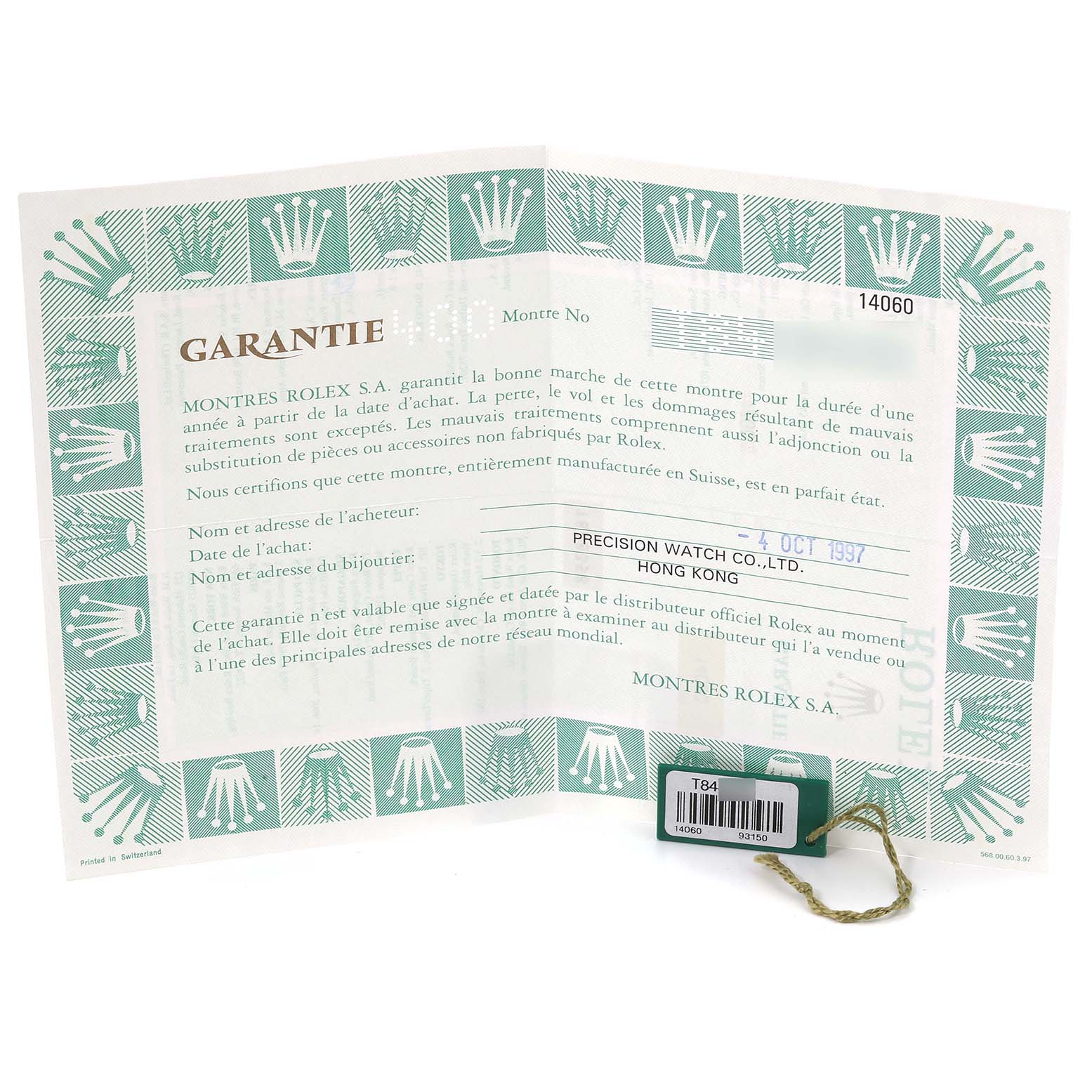 The image shows a guarantee card for the Rolex Submariner 14060 Men
s Stainless Steel Black Dial 14060 Men
s Stainless Steel Black Dial model along with a green Rolex tag displaying the model number 14060.