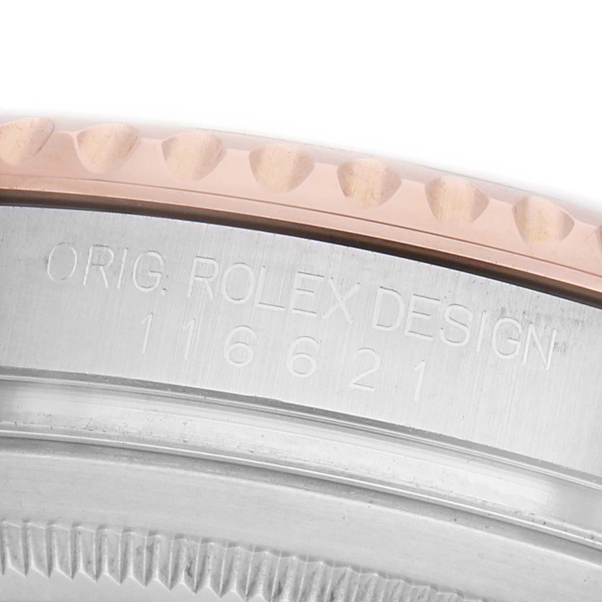 The image shows a close-up of the side of a Rolex Yacht-Master 116621 Men's Steel and Gold (two tone) Brown Dial, focusing on the bezel and engraved model number.