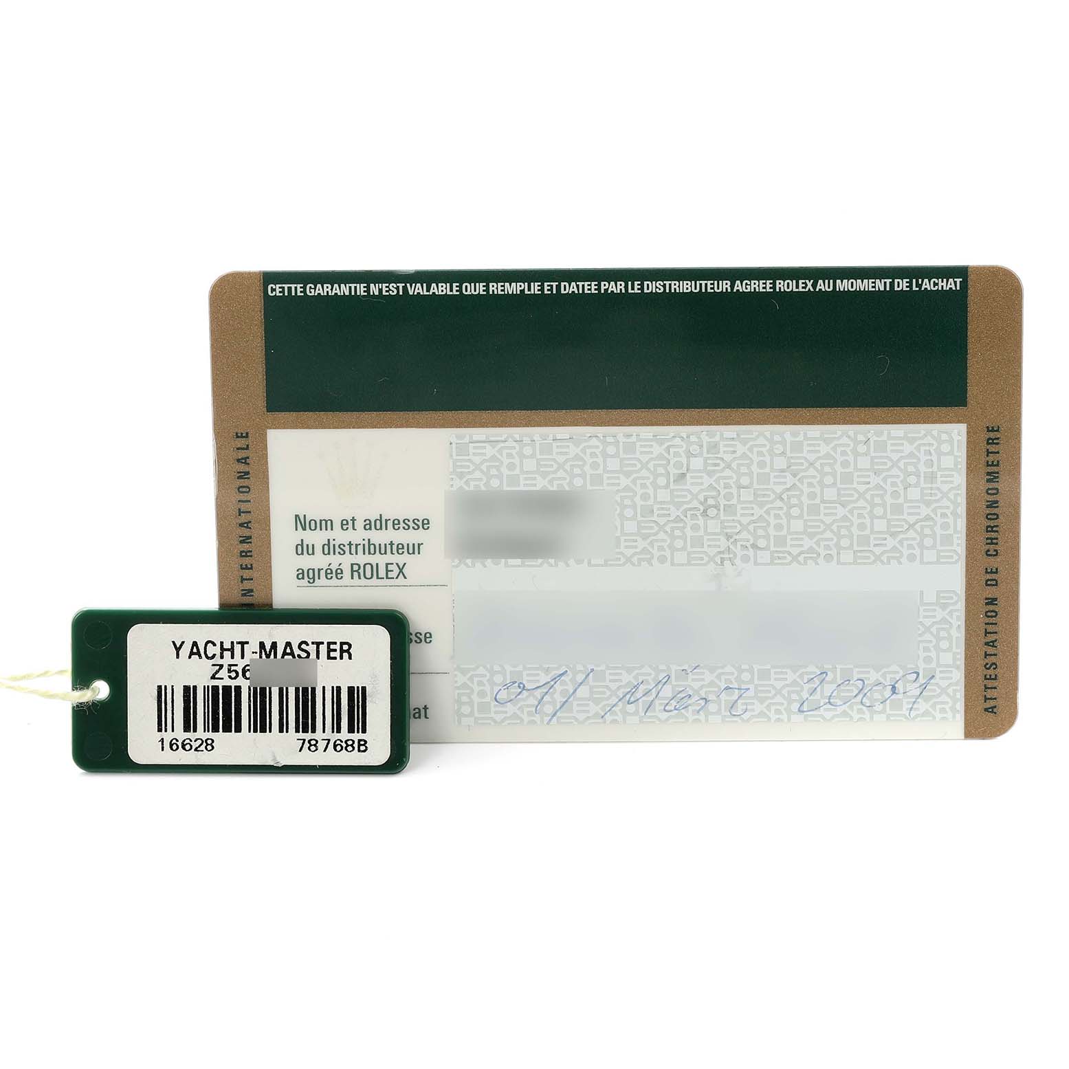 The image shows a Rolex Yacht-Master 16628 Men's Yellow Gold White Dial 16628 Men's Yellow Gold White Dial tag and warranty card from a front angle.