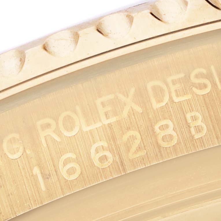 The image shows a close-up of the Rolex Yacht-Master 16628 Men's Yellow Gold White Dial 16628 Men's Yellow Gold White Dial's engraved side, highlighting the model and design number.