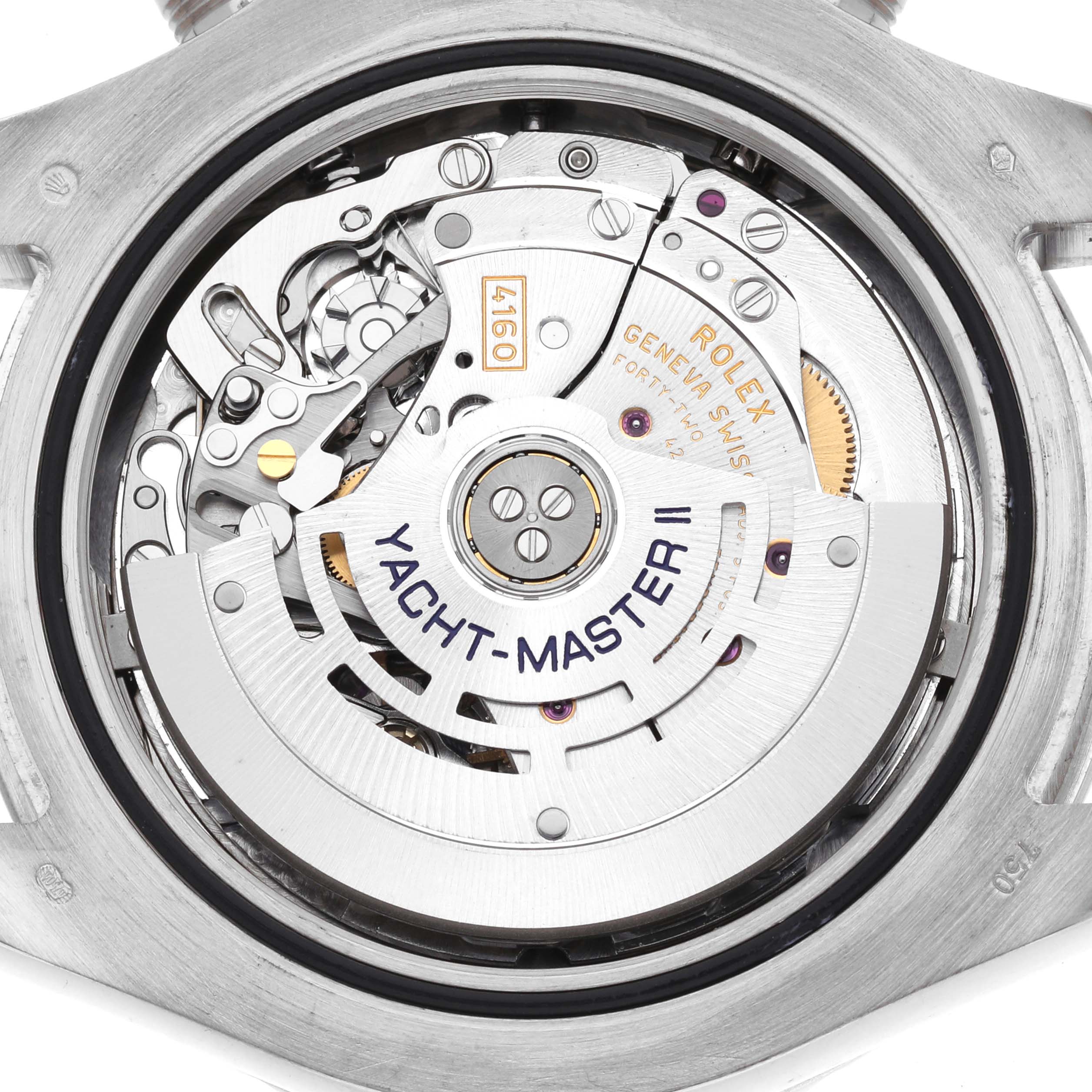 The image shows the Rolex Yacht-Master 116689M Men's White Gold White Dial watch movement from a top-down angle, highlighting its intricate mechanics.
