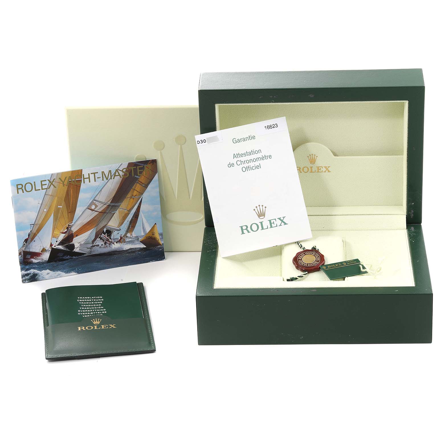 The image shows a Rolex Yacht-Master 16623 Men's Steel and Gold (two tone) White Dial 16623 Men's Steel and Gold (two tone) White Dial watch box, warranty card, booklets, and tags from a top-down angle.