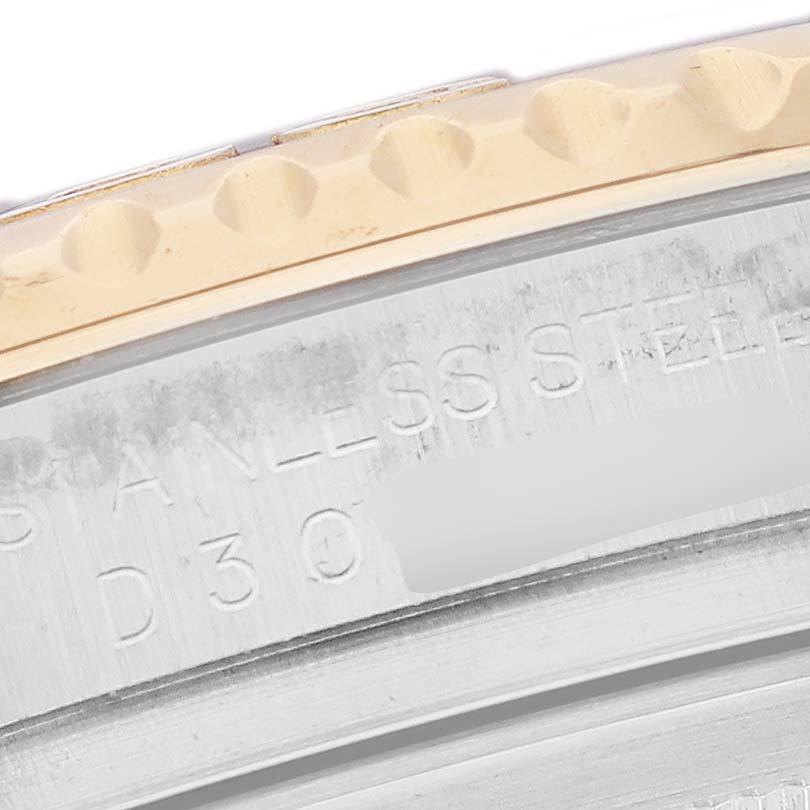 This image shows a close-up of the side of a Rolex Yacht-Master 16623 Men's Steel and Gold (two tone) White Dial 16623 Men's Steel and Gold (two tone) White Dial watch case, highlighting the stainless steel engraving and part of the bezel.