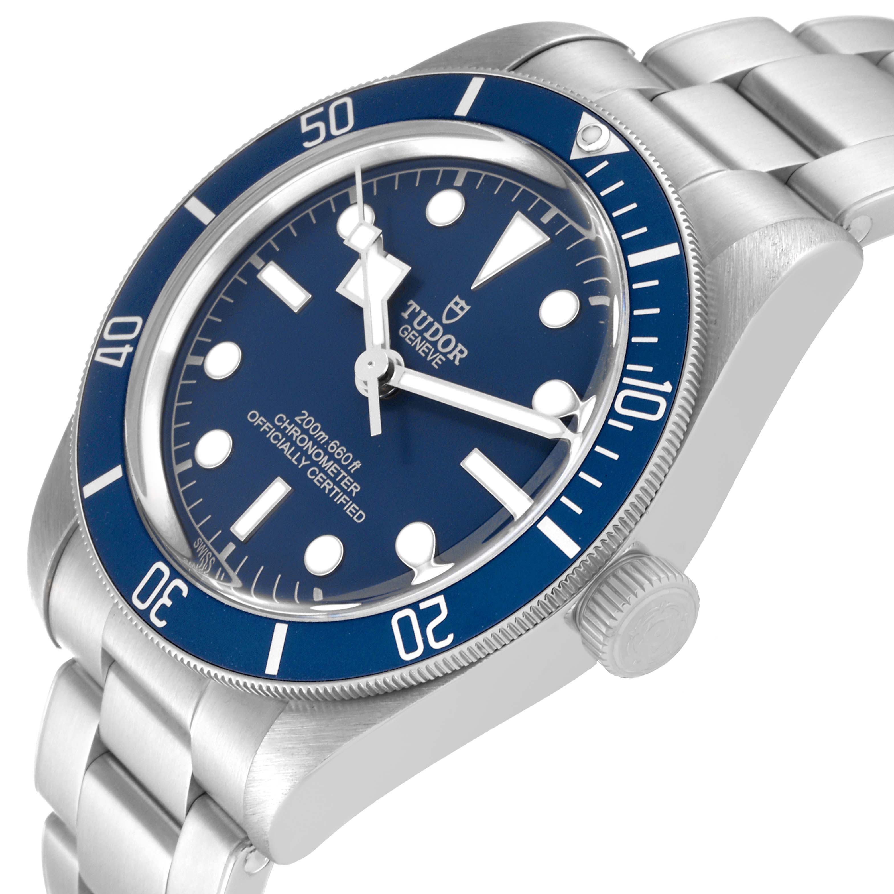 The image shows a Heritage Black Bay model by Tudor from an angled side view, displaying the face, bezel, and part of the bracelet.