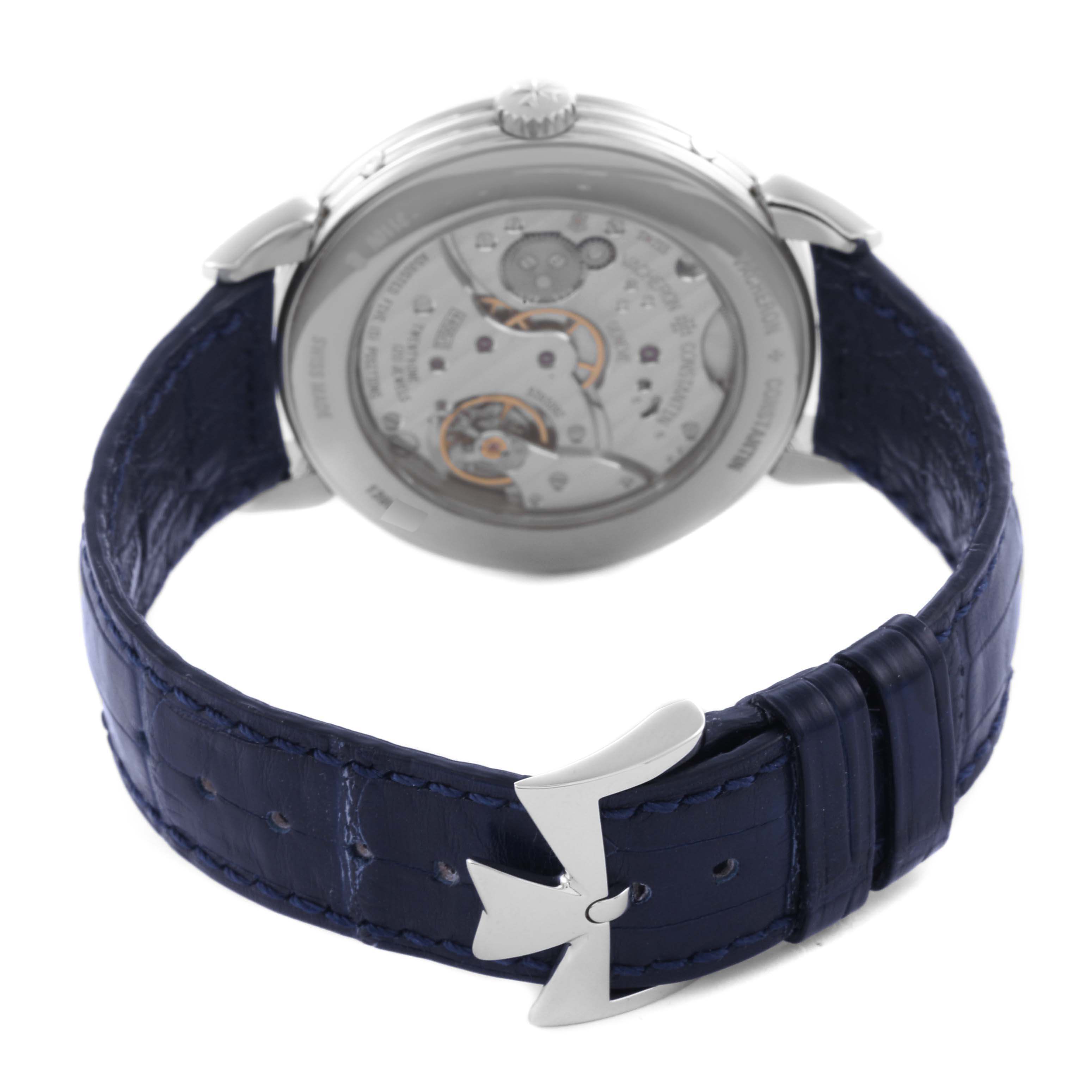 The Vacheron Constantin Historiques 3110V/000A Men's Stainless Steel Silver Dial 3110V/000A Men's Stainless Steel Silver Dial watch is shown from a rear angle, highlighting its movement and blue leather strap with a Maltese cross buckle.
