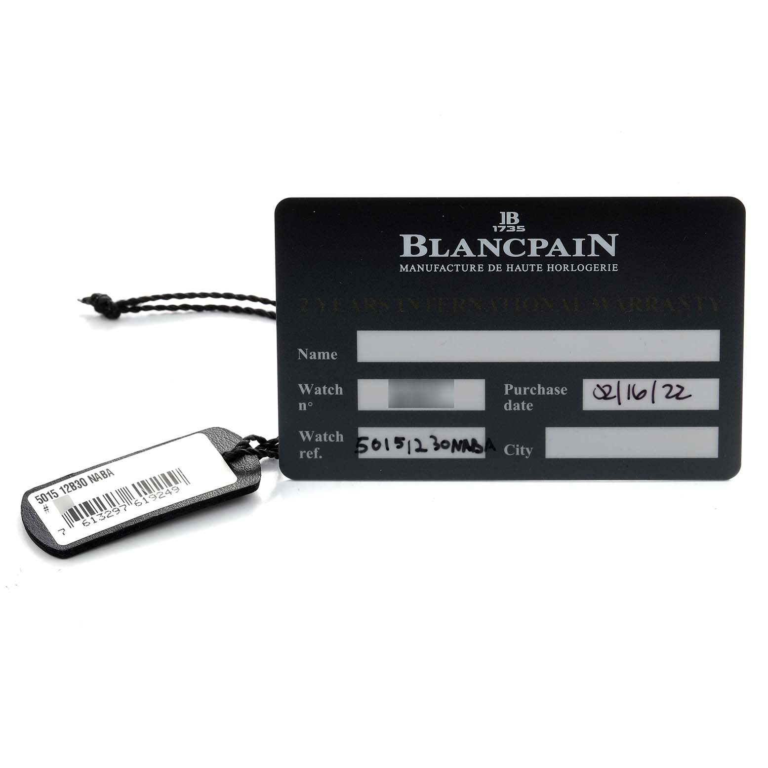 The image shows a Blancpain Fifty Fathoms 5015-12B30 Men's Titanium Black Dial warranty card and a tag with model details from a flat angle.