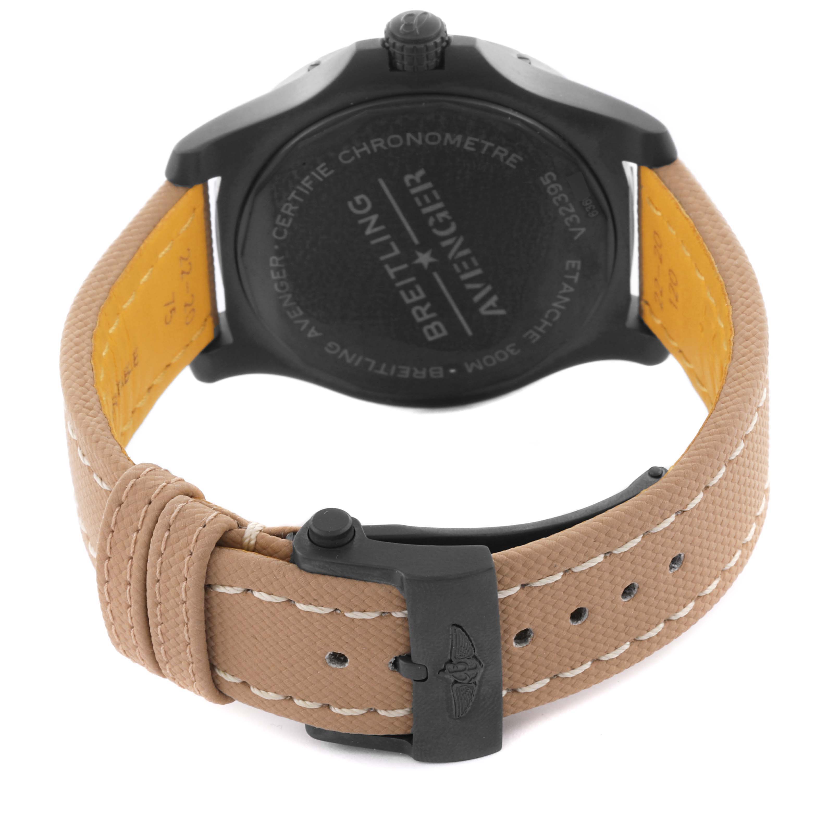 The image shows the back view of a Breitling Avenger V32395101B1X1 Men's Titanium Black Dial V32395101B1X1 Men's Titanium Black Dial watch, highlighting the case and beige strap with a black buckle.
