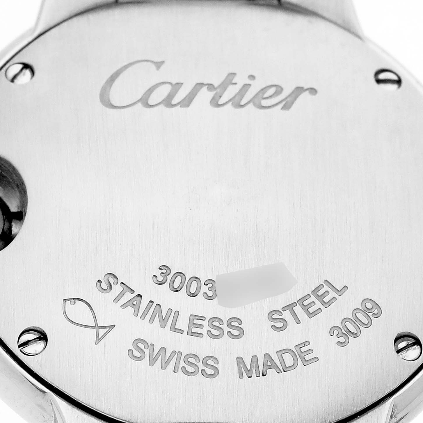 The image shows the back case of the Ballon Bleu by Cartier, highlighting engravings and the stainless steel material.