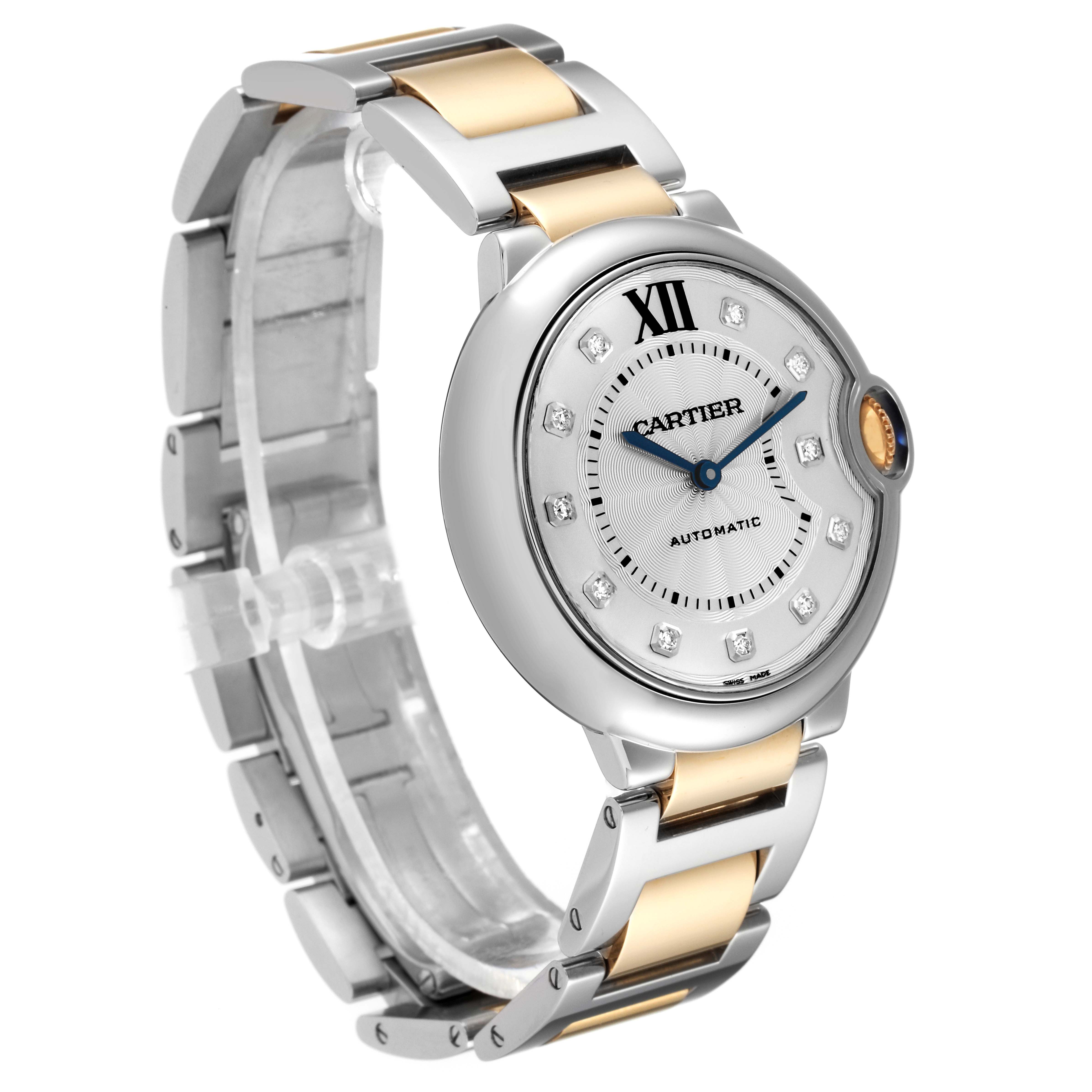 This Ballon Bleu de Cartier watch is shown from a three-quarter angle, highlighting its dial, crown, and two-tone bracelet.