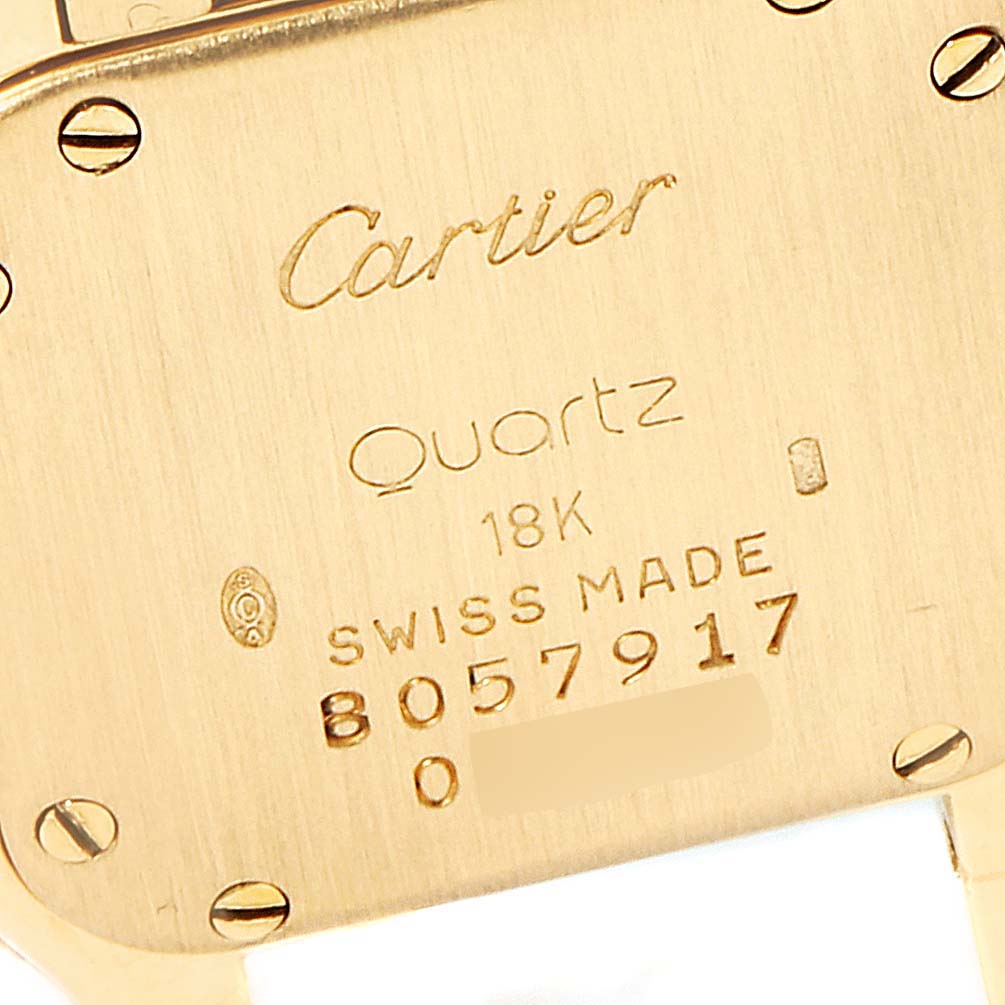 The image shows the back case of a Cartier Panthere W25022B9 Women
s Yellow Gold Silver Dial W25022B9 Women
s Yellow Gold Silver Dial model watch, highlighting engravings and screws.