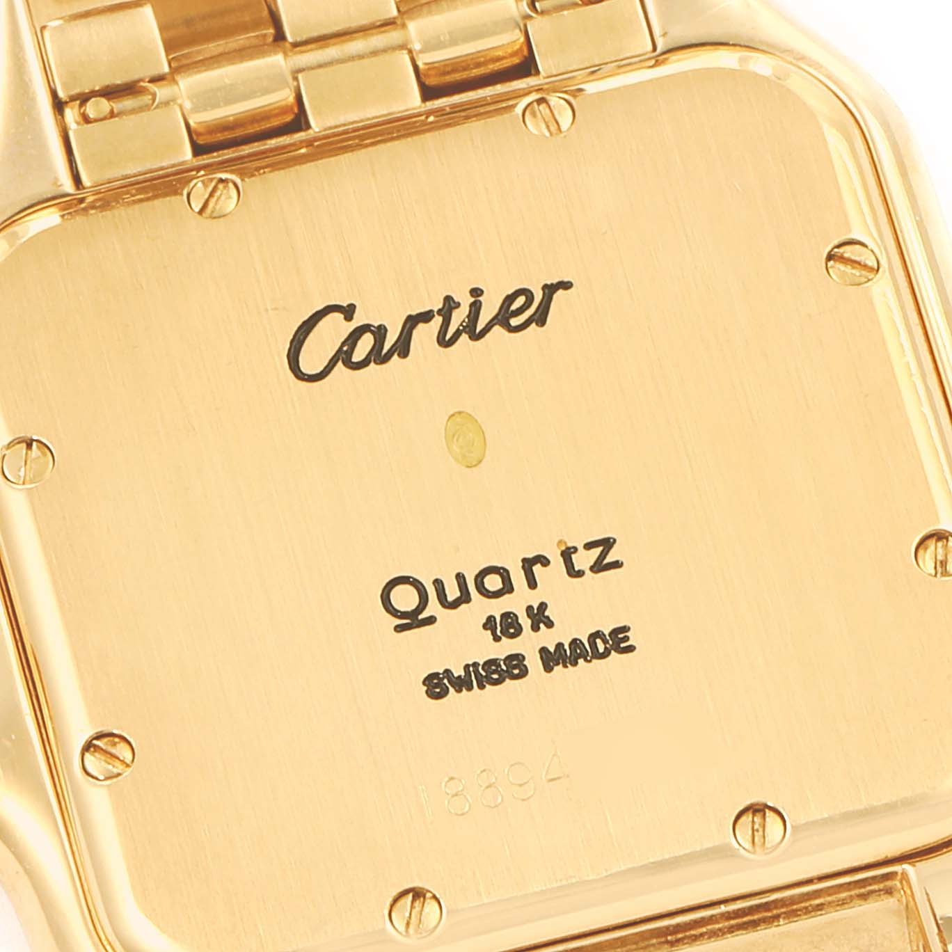 This image shows the caseback of a Cartier Panthere W25014B9 Men's Yellow Gold Silver Dial W25014B9 Men's Yellow Gold Silver Dial watch, highlighting its markings and part of the bracelet.