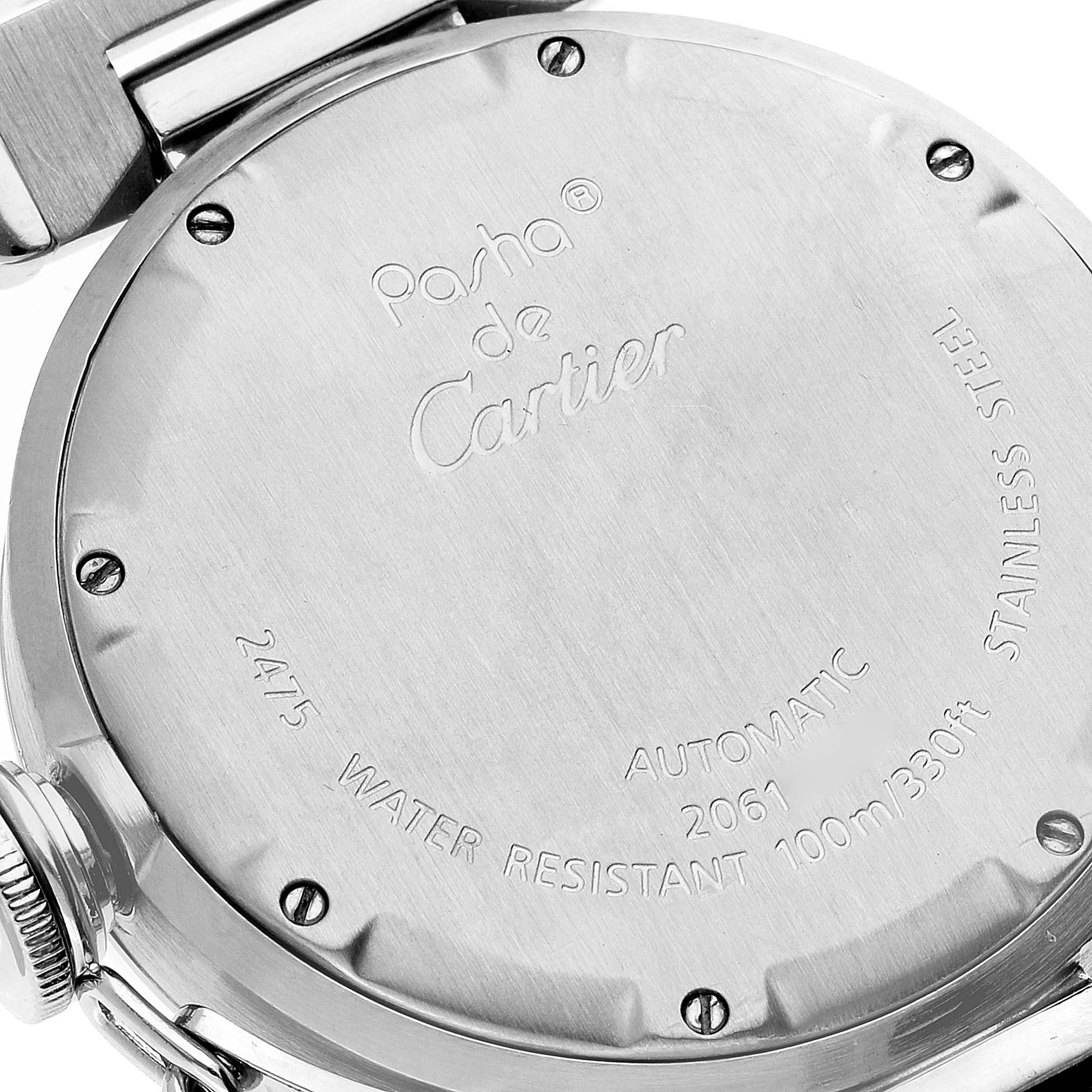 This image shows the back case of the Pasha de Cartier watch, highlighting its engravings and screws.