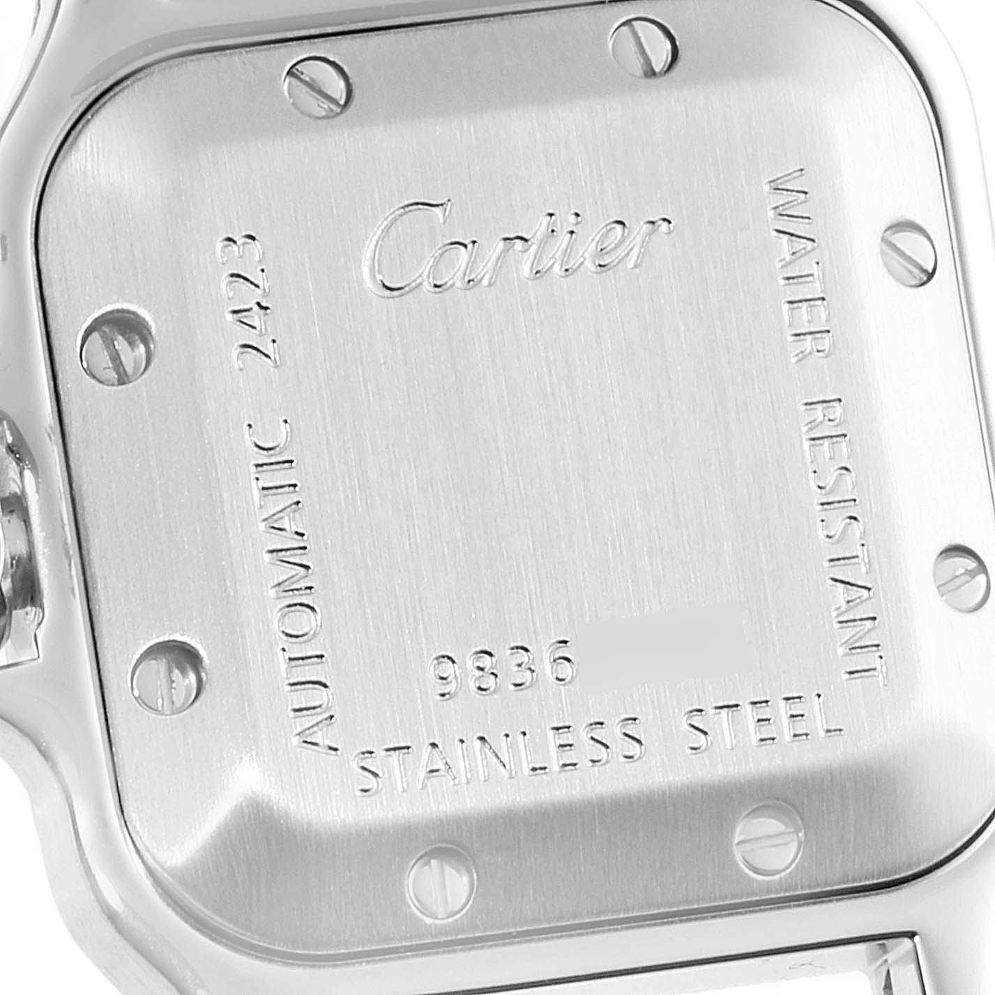 The image shows the back case of a Santos model by Cartier, highlighting the engravings and screws.