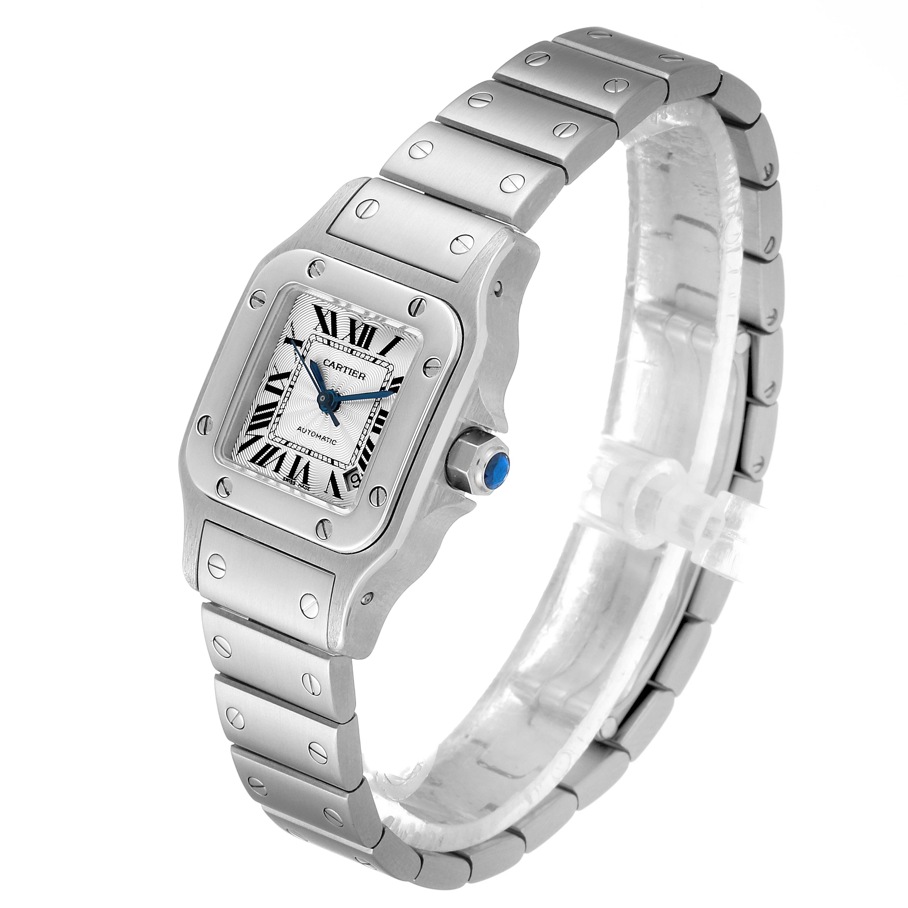 The Cartier Santos W20044D6 Women's Stainless Steel Silver Dial W20044D6 Women's Stainless Steel Silver Dial watch is shown at a three-quarter angle, displaying its face, bezel, crown, and partially wrapped bracelet.