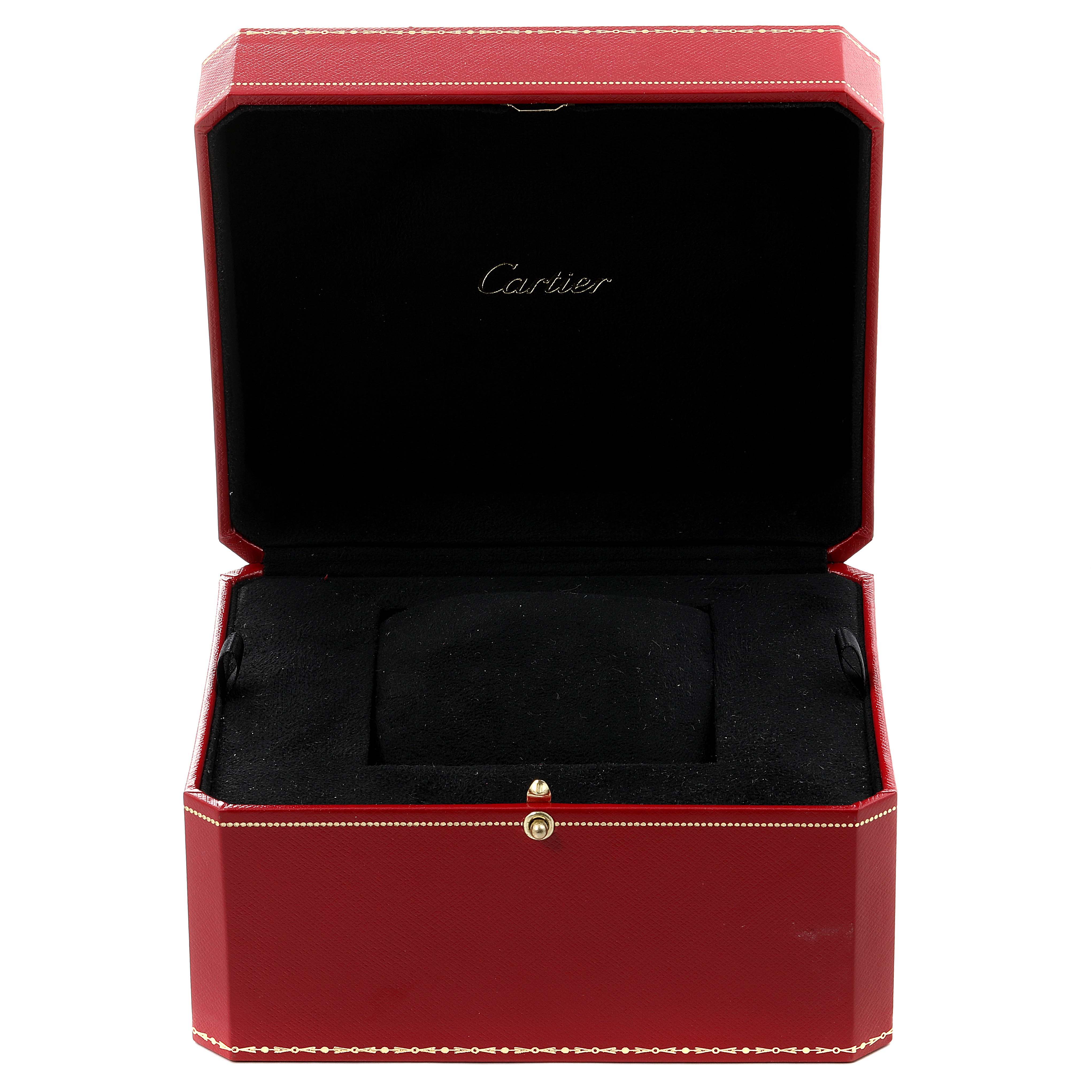 The image shows an open red Cartier box for the Tank Americaine model, revealing the interior cushioning.