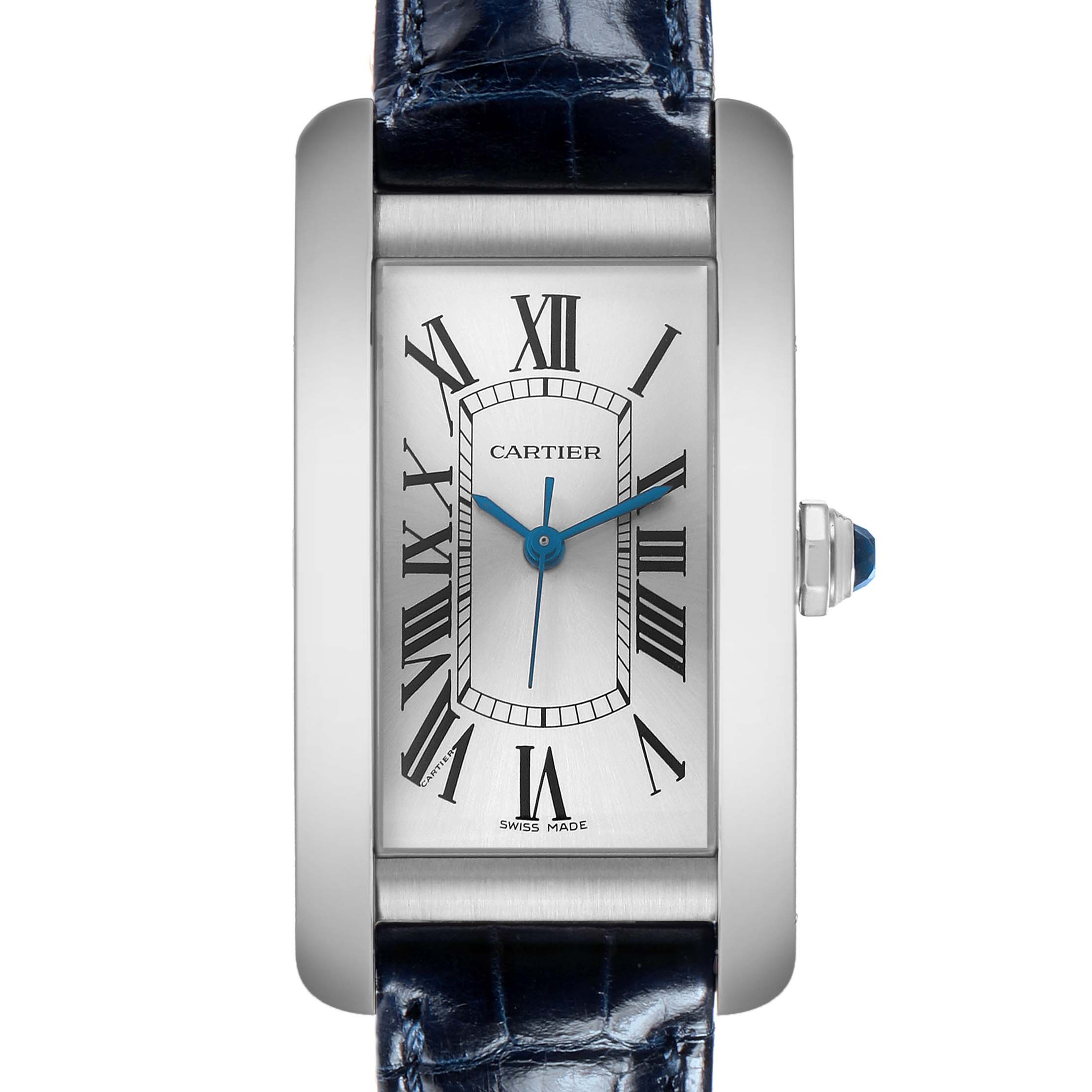 The Cartier Tank Americaine WSTA0017 Women's Stainless Steel Silver Dial watch is shown from a front view, highlighting its rectangular face, Roman numerals, and blue leather strap.