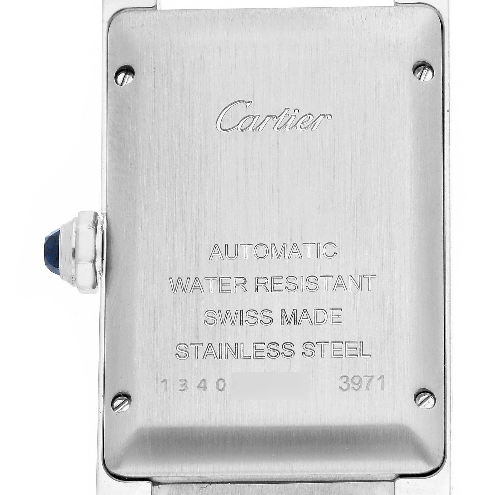 The image shows the back of the Cartier Tank Américaine watch, highlighting its engravings and crown with a blue detail.