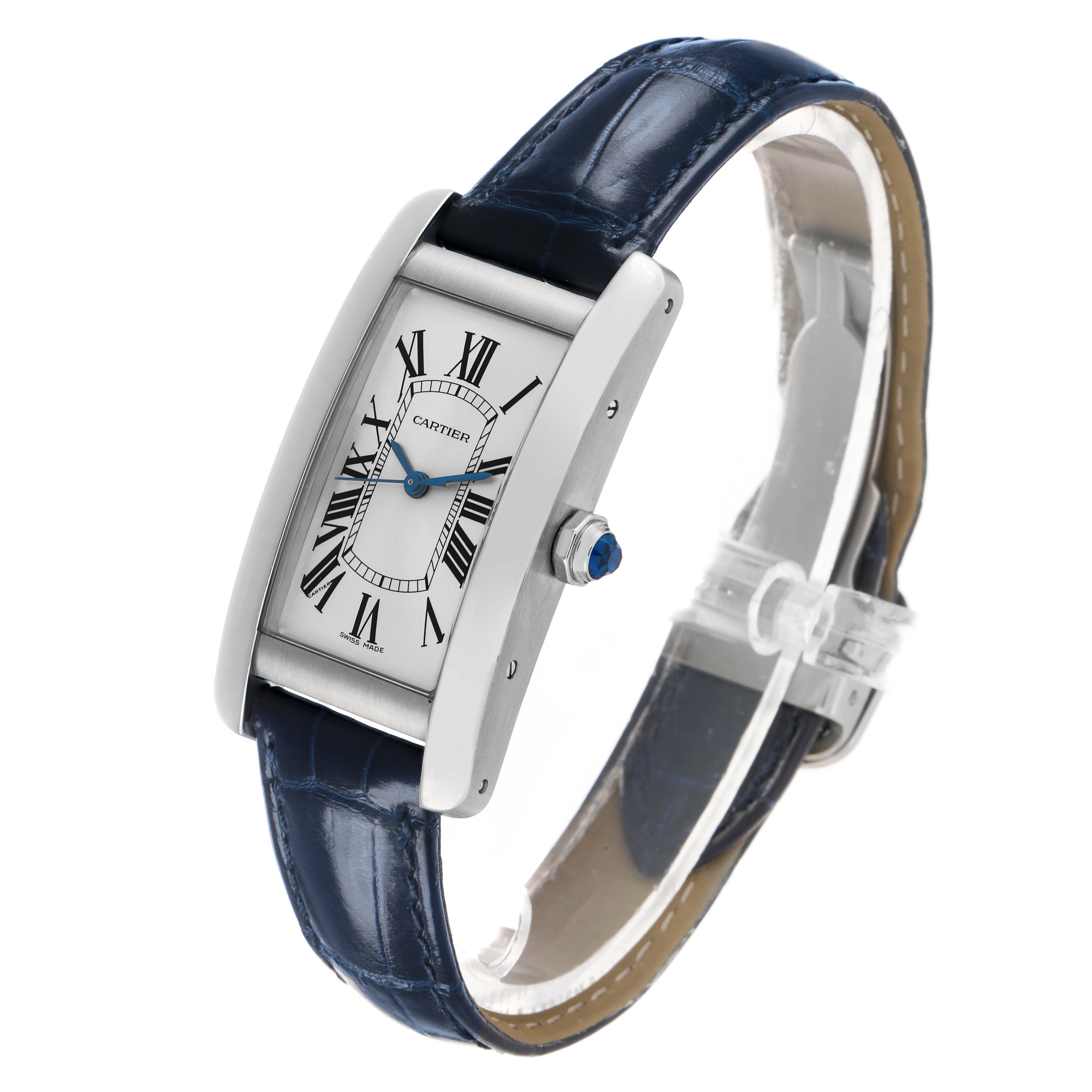 The Cartier Tank Americaine WSTA0017 Women's Stainless Steel Silver Dial watch is shown at an angled side view, displaying its rectangular case, blue strap, and crown.