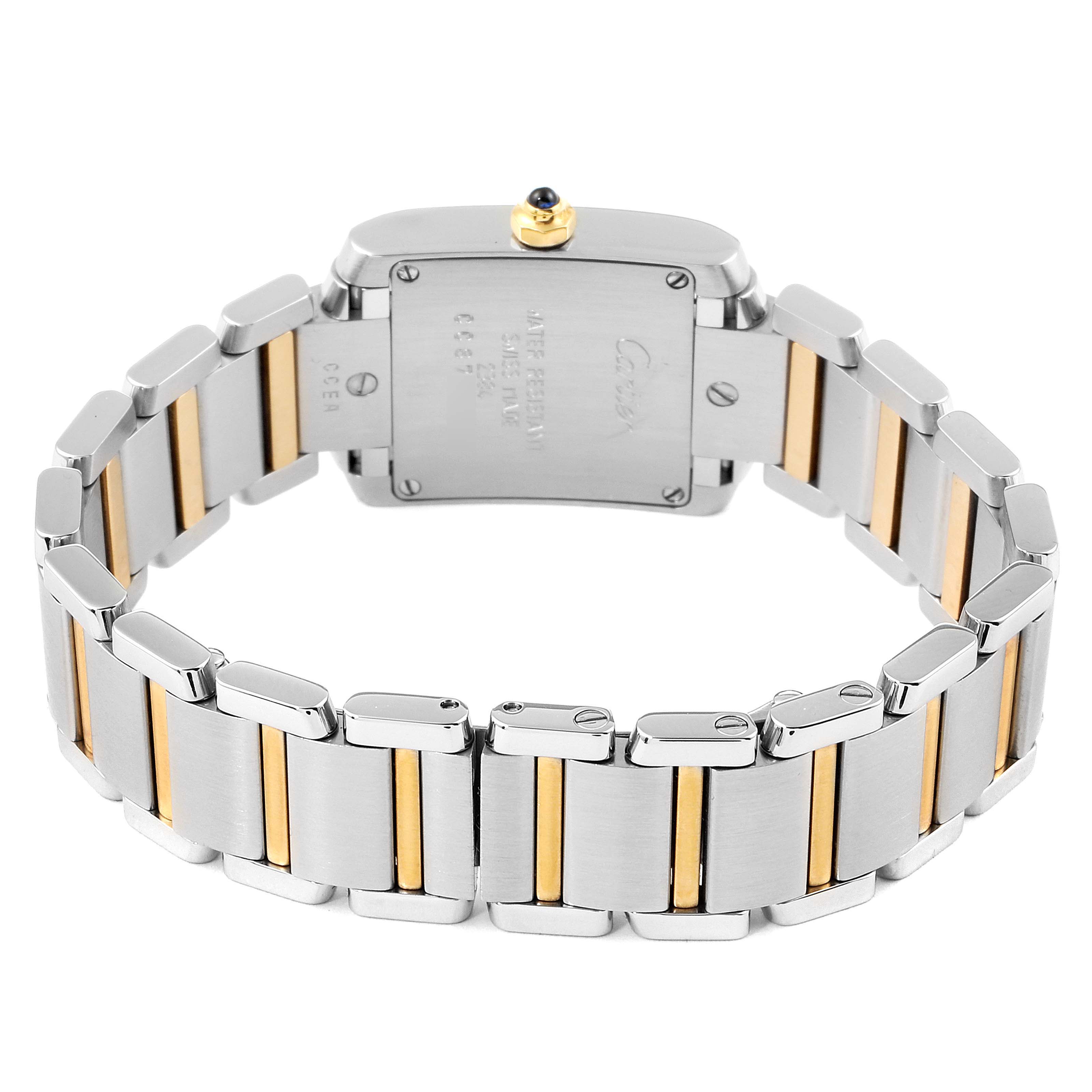 This image shows the back view of the Tank Francaise watch by Cartier, highlighting its metal band and case back.