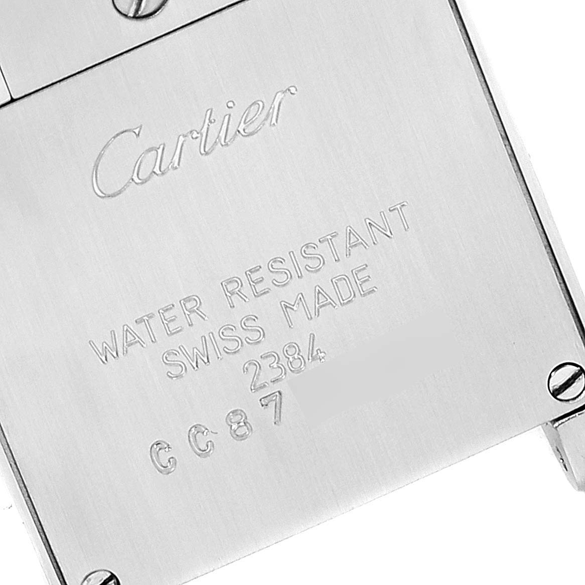 The image shows the case back of a Cartier Tank Francaise W51007Q4 Women's Steel and Gold (two tone) Silver Dial W51007Q4 Women's Steel and Gold (two tone) Silver Dial watch, highlighting the engraved brand name and specifications.