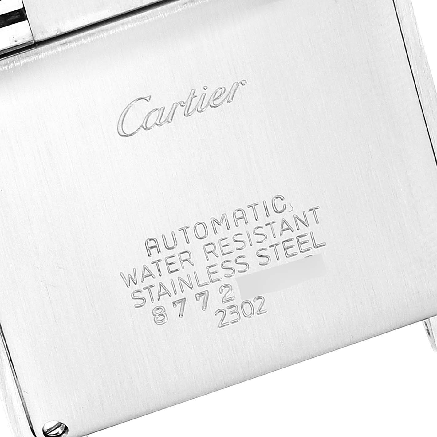This image shows the back case of a Cartier Tank Française watch, displaying the brand name and specifications.
