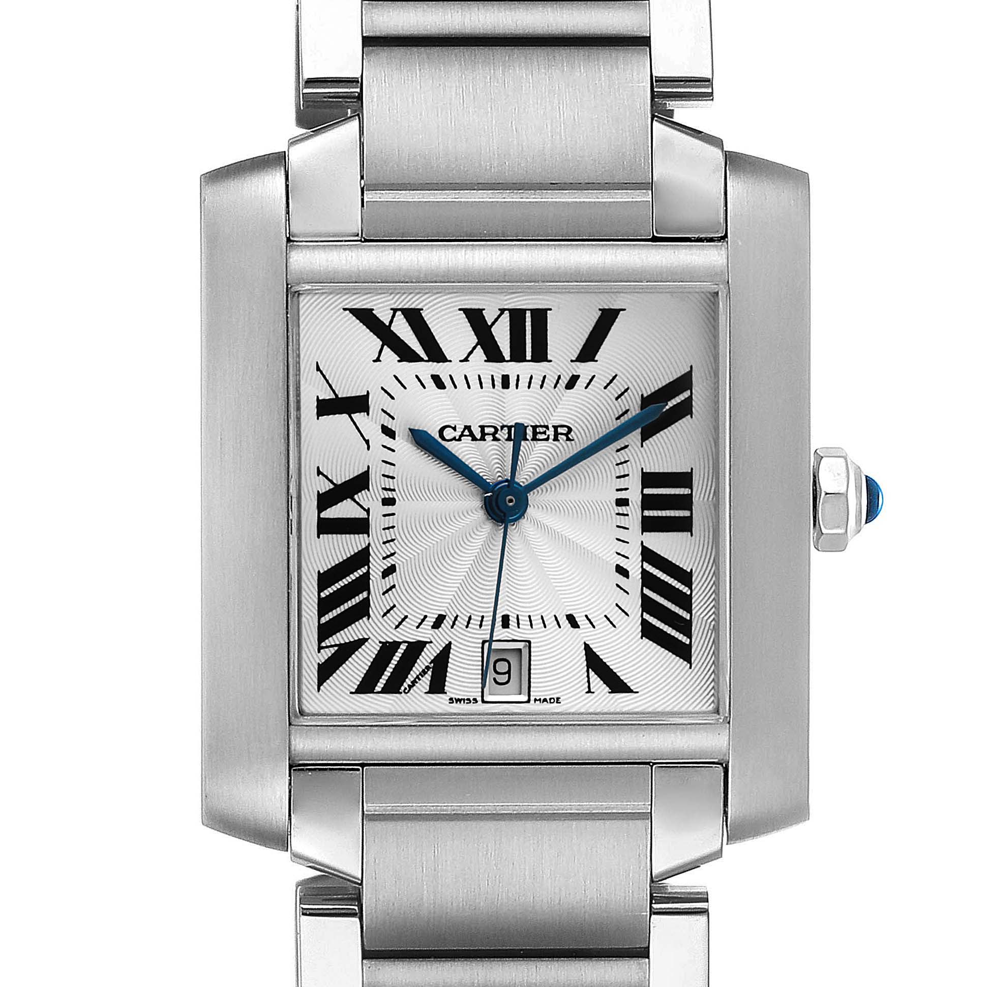 The image shows a close-up of the Cartier Tank Francaise W51002Q3 Men's Stainless Steel Silver Dial W51002Q3 Men's Stainless Steel Silver Dial watch, highlighting its face, Roman numerals, blue hands, date window, and metal bracelet.