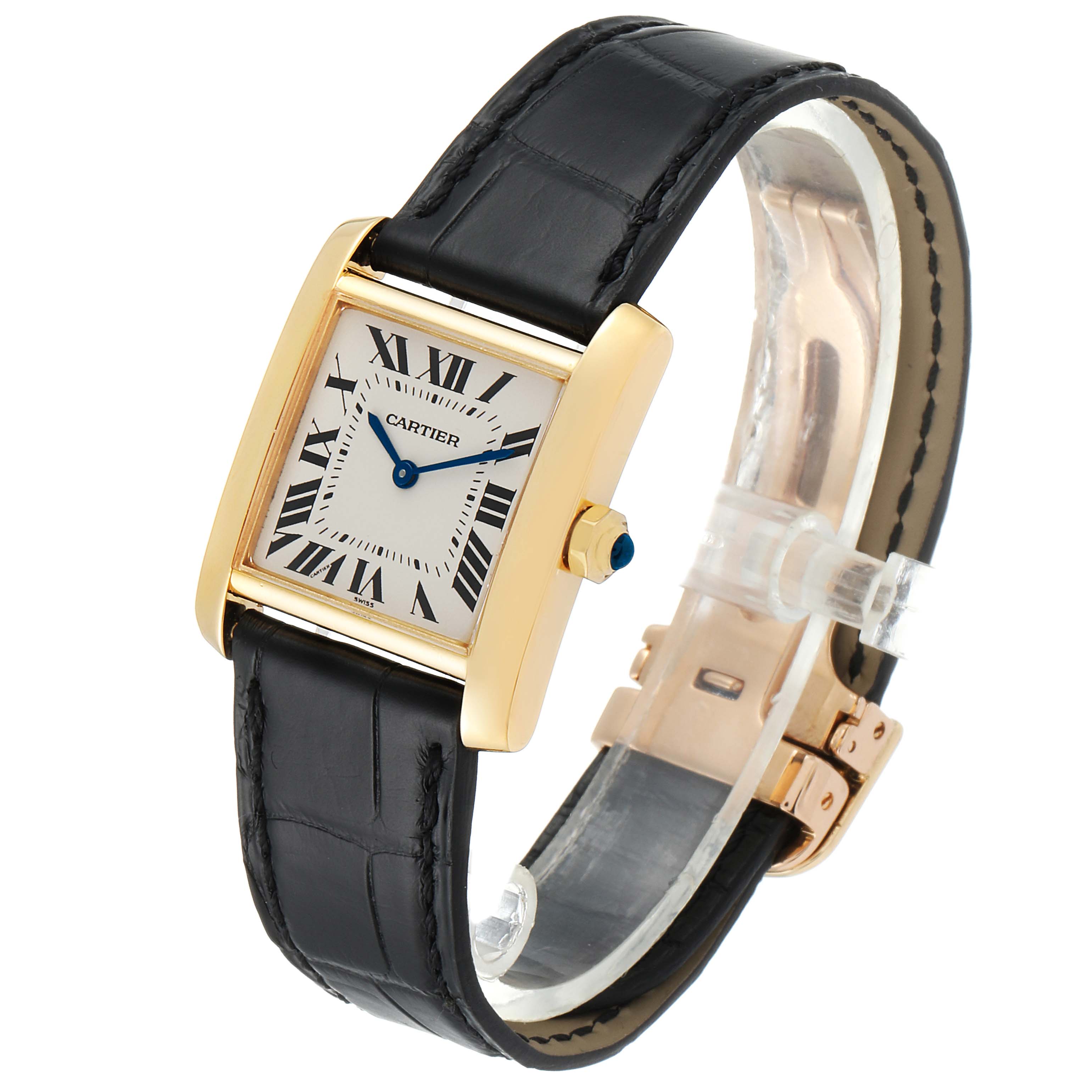 The Cartier Tank Française watch is shown at a slight angle, featuring its rectangular gold case, Roman numeral dial, and black leather strap.