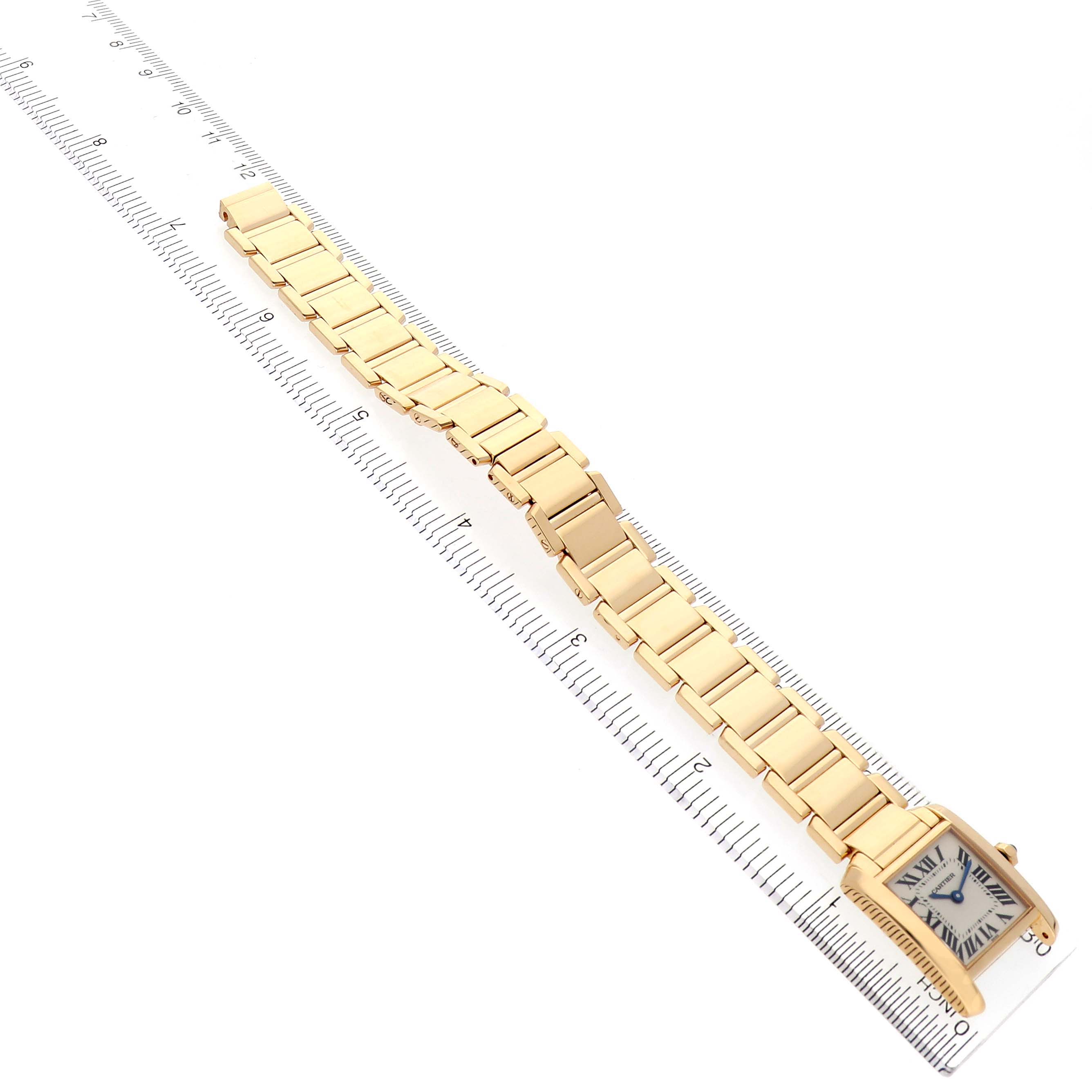 The Cartier Tank Francaise W50002N2 Women's Yellow Gold White Dial W50002N2 Women's Yellow Gold White Dial watch is shown from a diagonal top view, highlighting its bracelet and face.