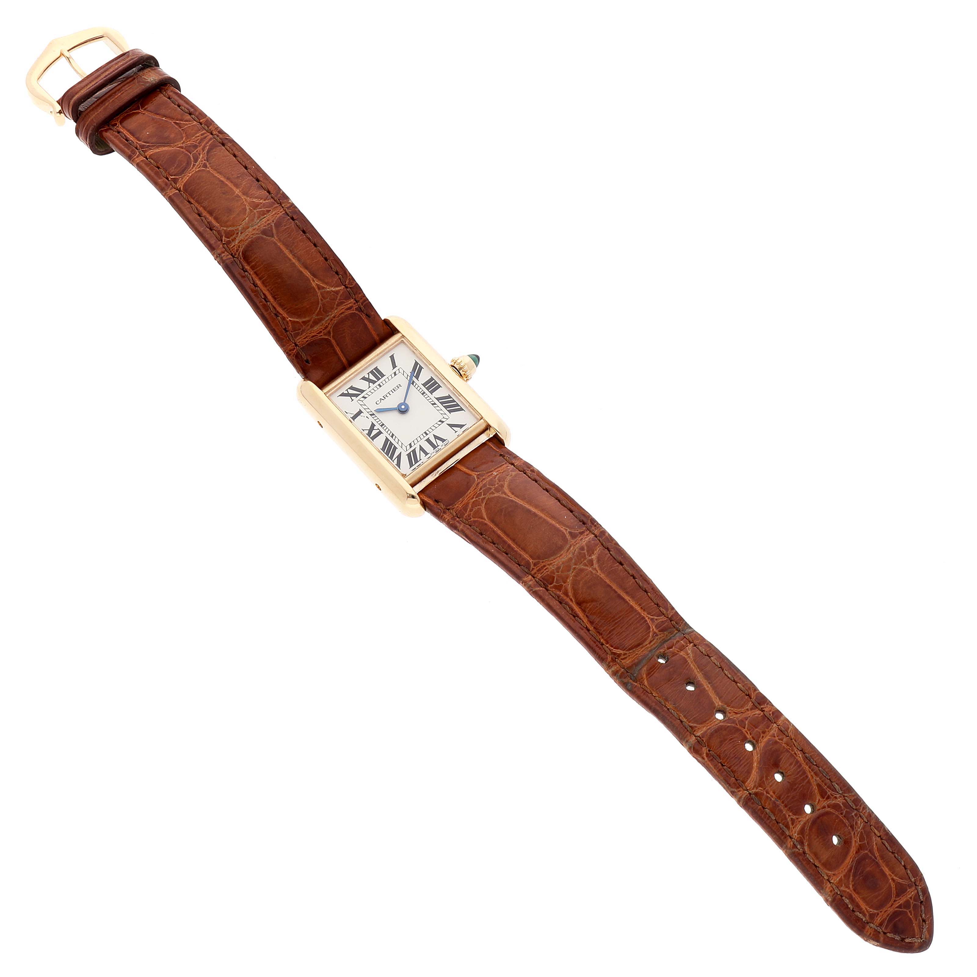 This image shows a Cartier Tank Louis W1529856 Women
s Yellow Gold Silver Dial W1529856 Women
s Yellow Gold Silver Dial watch from a top-down angle, displaying the rectangular dial and brown leather strap.