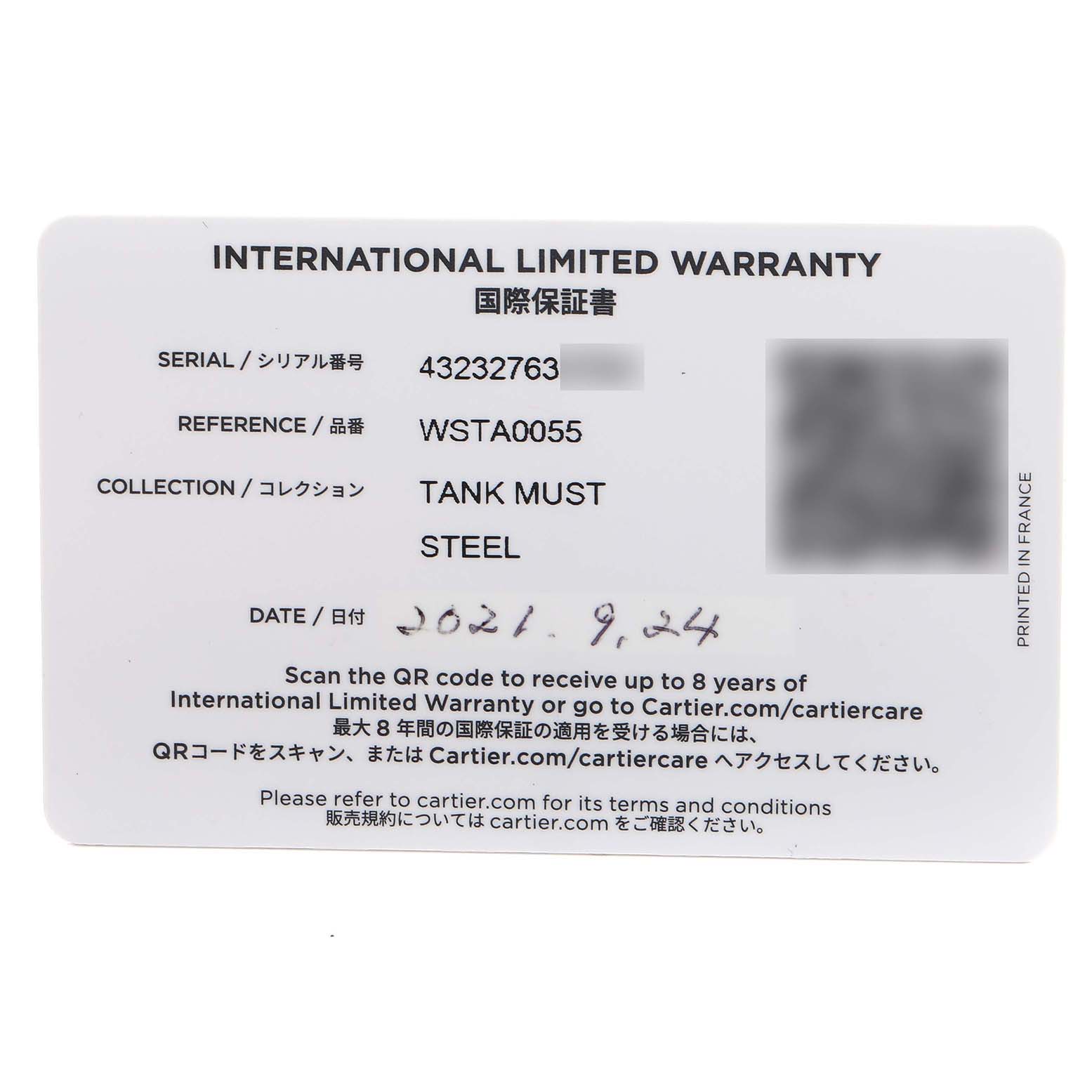 The image shows the International Limited Warranty card for a Cartier Tank Must WSTA0055 Women's Stainless Steel Blue Dial watch model.