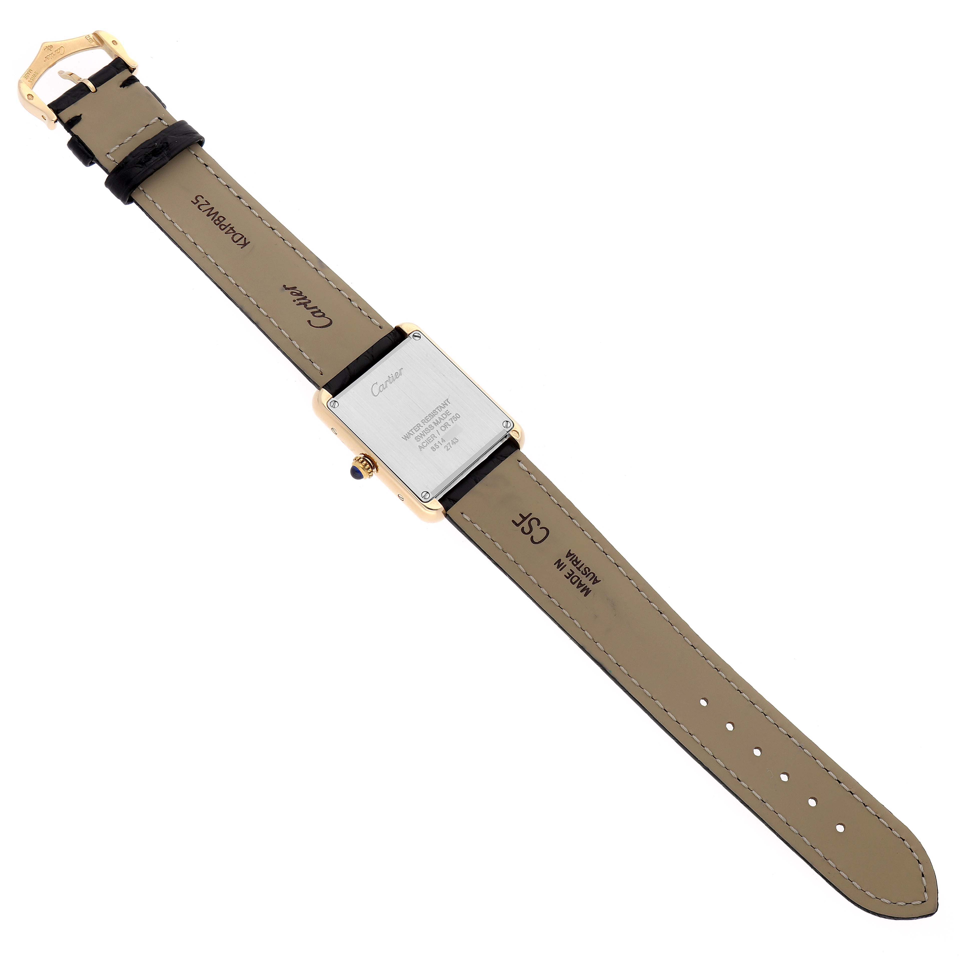 The image shows the back of a Cartier Tank Solo W1018755 Women's Yellow Gold Silver Dial watch, displaying its case and leather strap.