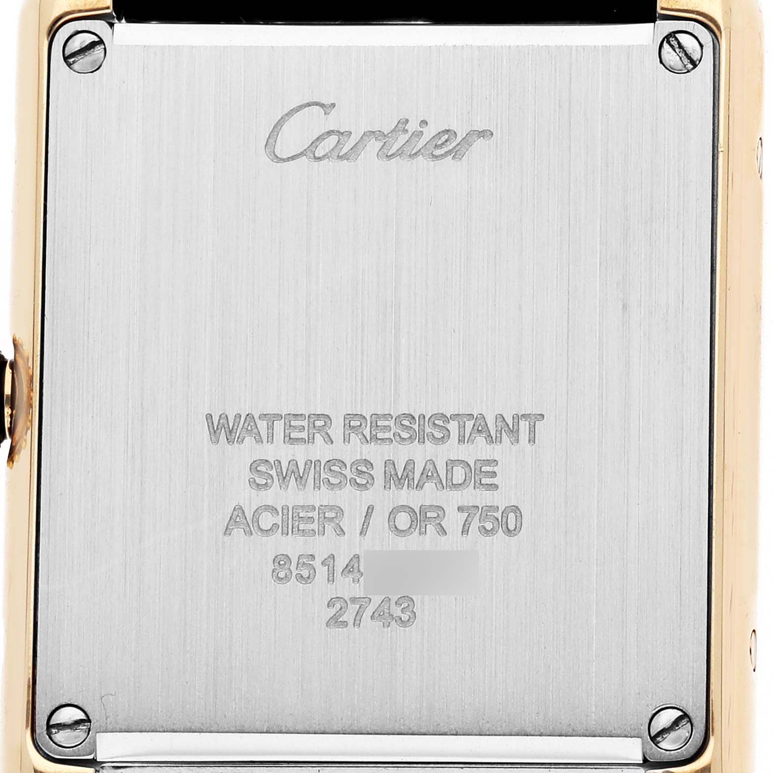 The image shows the back case of the Cartier Tank Solo W1018755 Women's Yellow Gold Silver Dial watch, highlighting the brand and specifications.